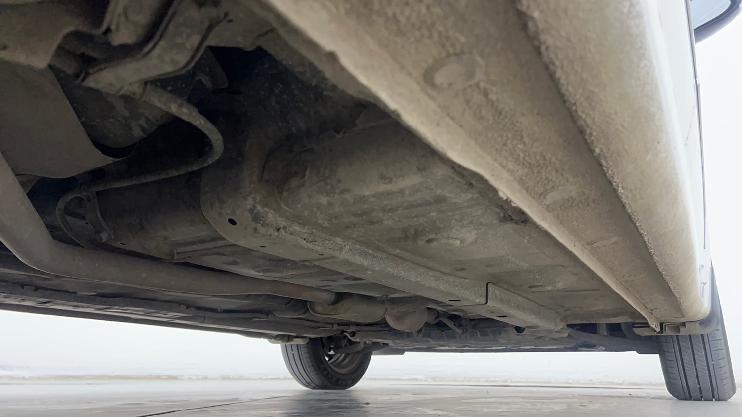 Used 2022 Hyundai Aura S 1.2 AMT Petrol Petrol Automatic extra REAR RIGHT UNDERBODY VIEW