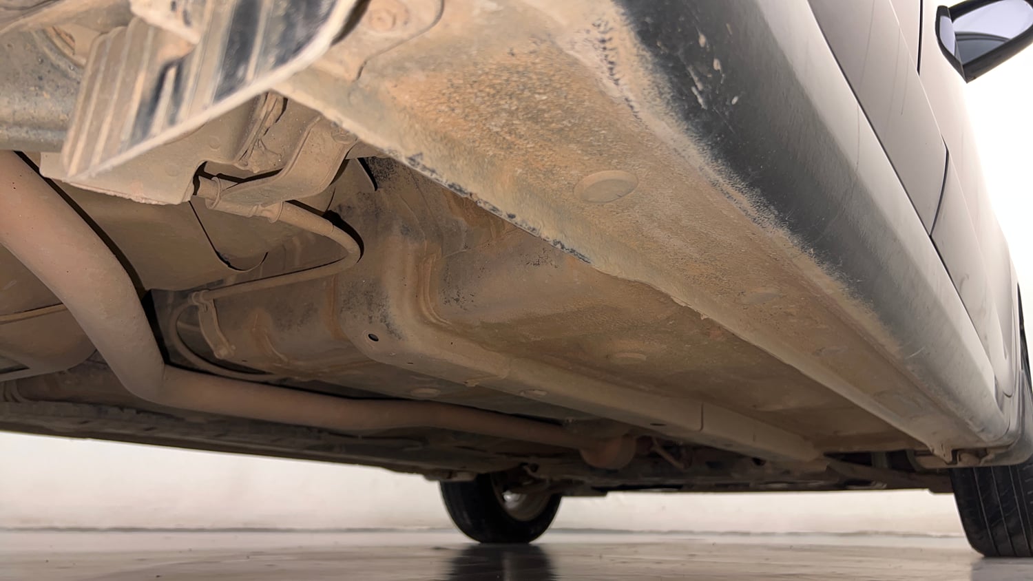 Used 2020 Hyundai Aura SX 1.2 (O) Petrol Petrol Manual extra REAR RIGHT UNDERBODY VIEW