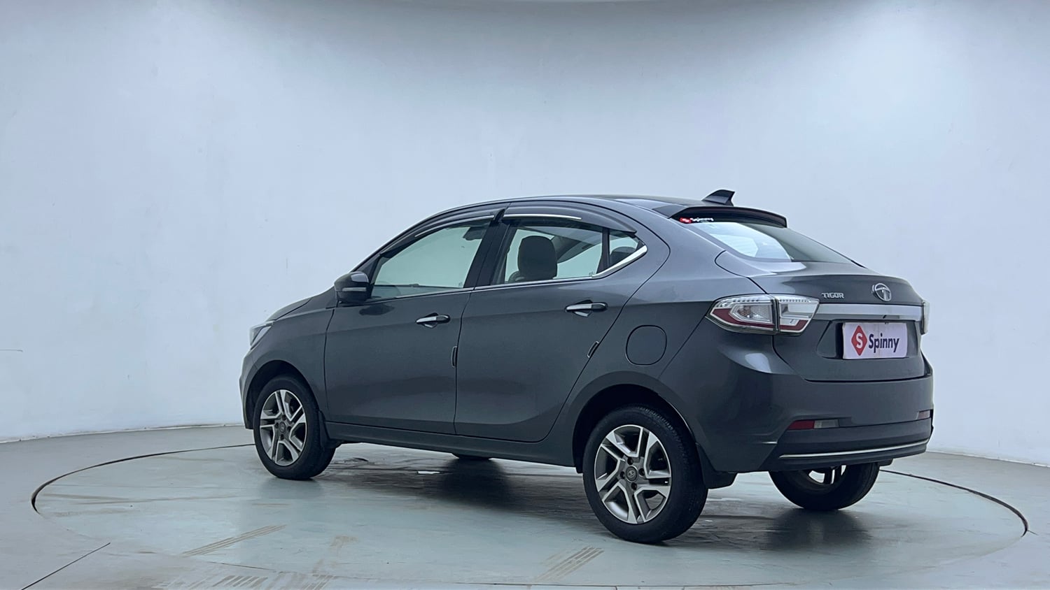Used 2023 Tata Tigor XZ Plus Petrol Manual exterior LEFT REAR CORNER VIEW