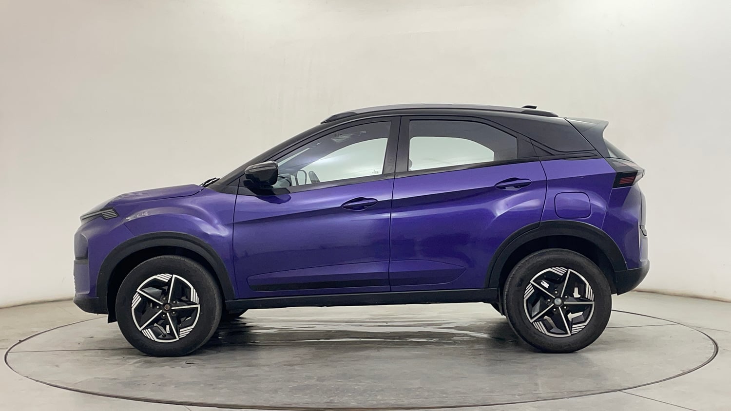 Used 2024 Tata Nexon Fearless Plus S Purple 1.2 Revotron Petrol 7DCA Dual Tone Petrol Automatic exterior LEFT SIDE VIEW