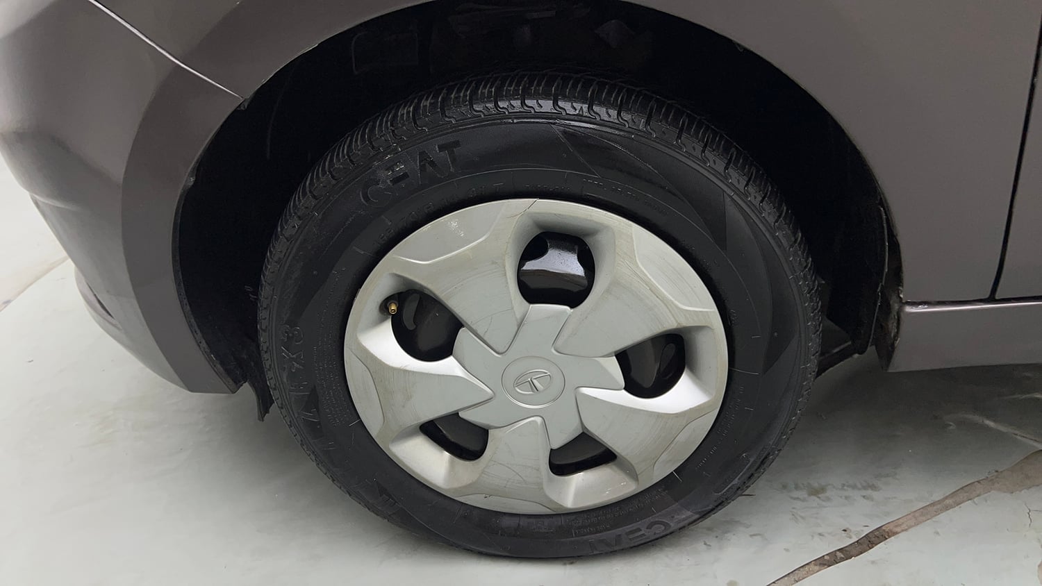 Used 2019 Tata Tiago Revotron XT Petrol Manual tyres LEFT FRONT TYRE RIM VIEW