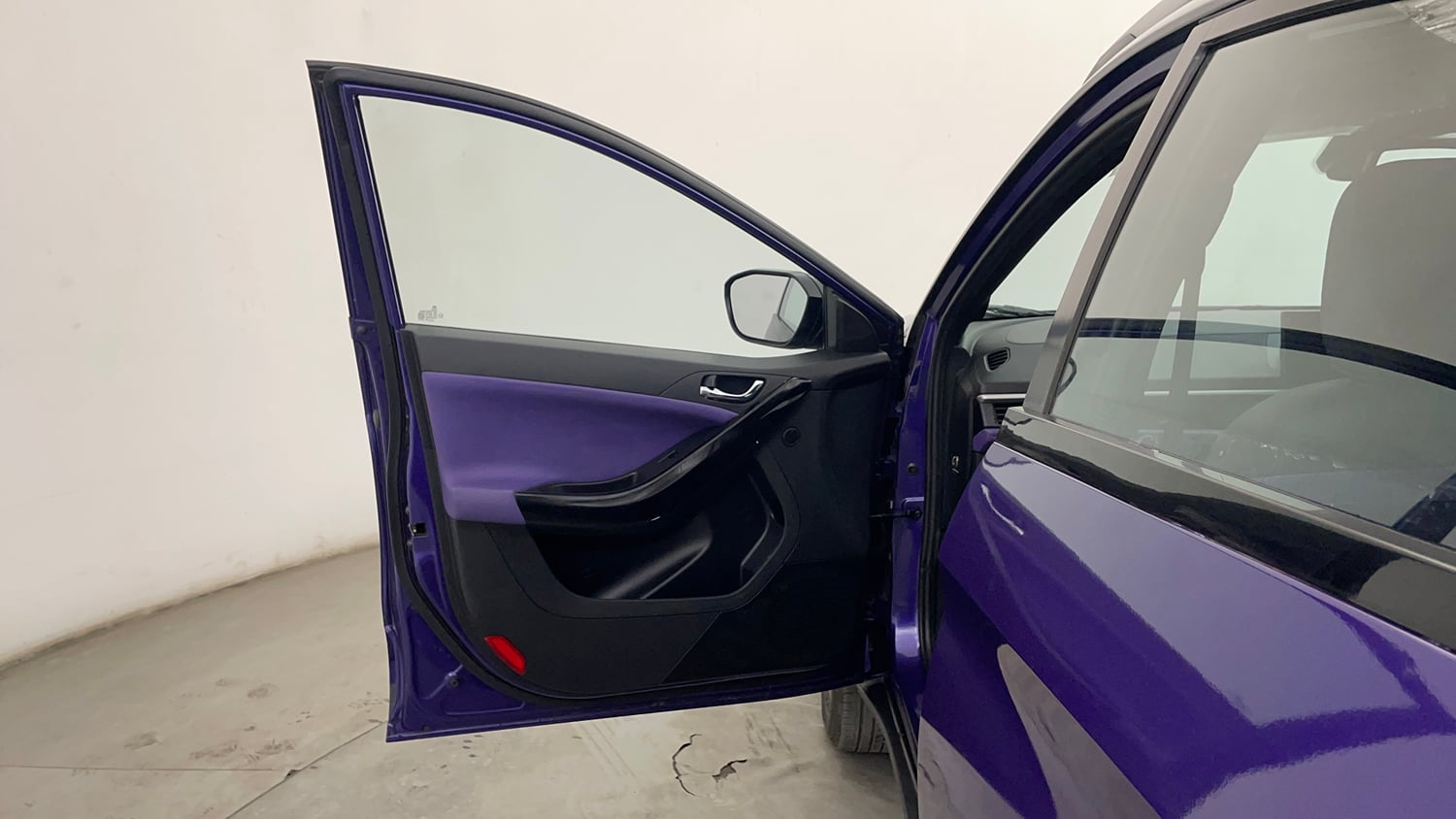 Used 2024 Tata Nexon Fearless Plus S Purple 1.2 Revotron Petrol 7DCA Dual Tone Petrol Automatic interior LEFT FRONT DOOR OPEN VIEW
