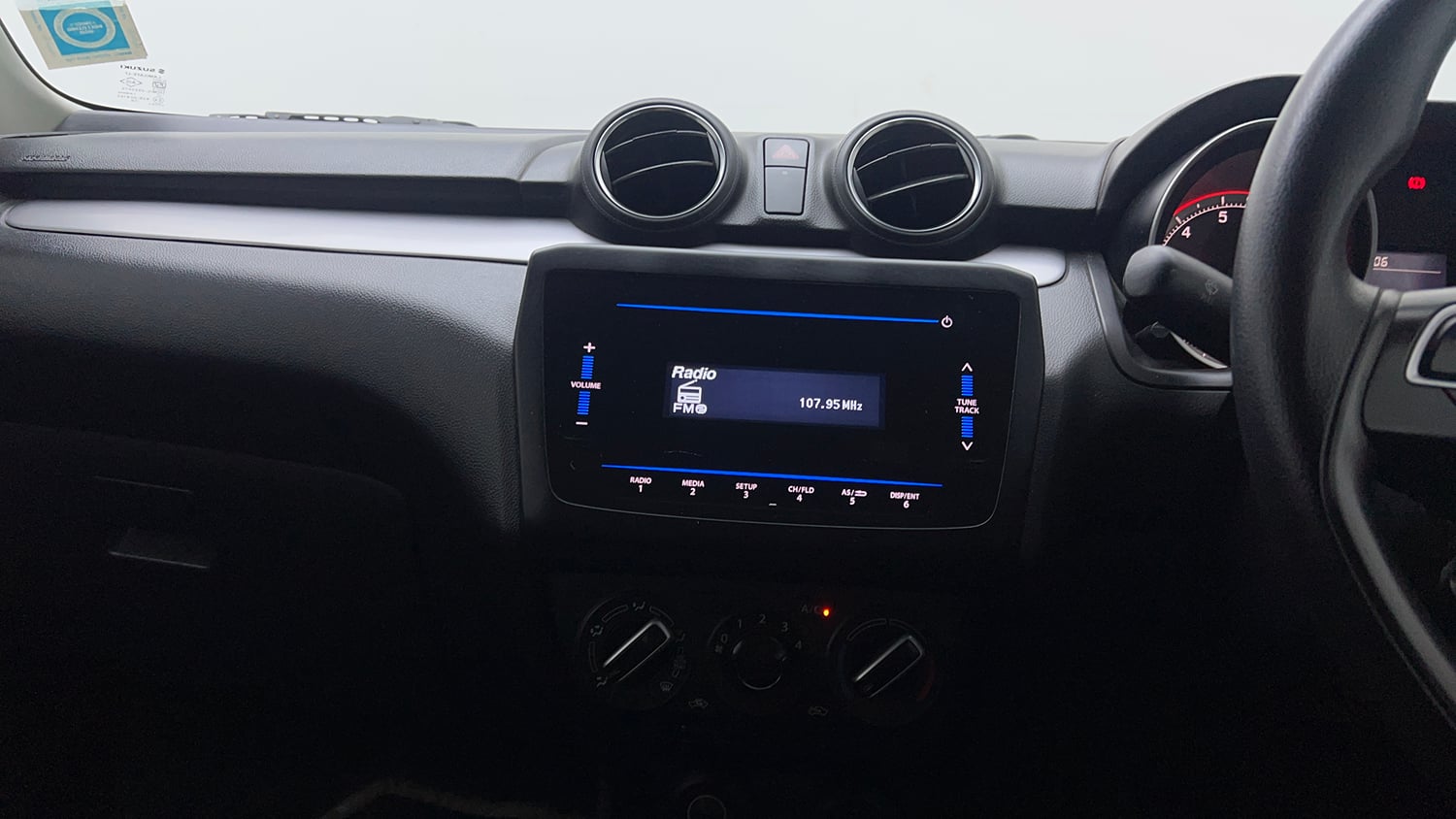 Used 2021 Maruti Suzuki Swift VXi Petrol Manual top_features Integrated (in-dash) music system