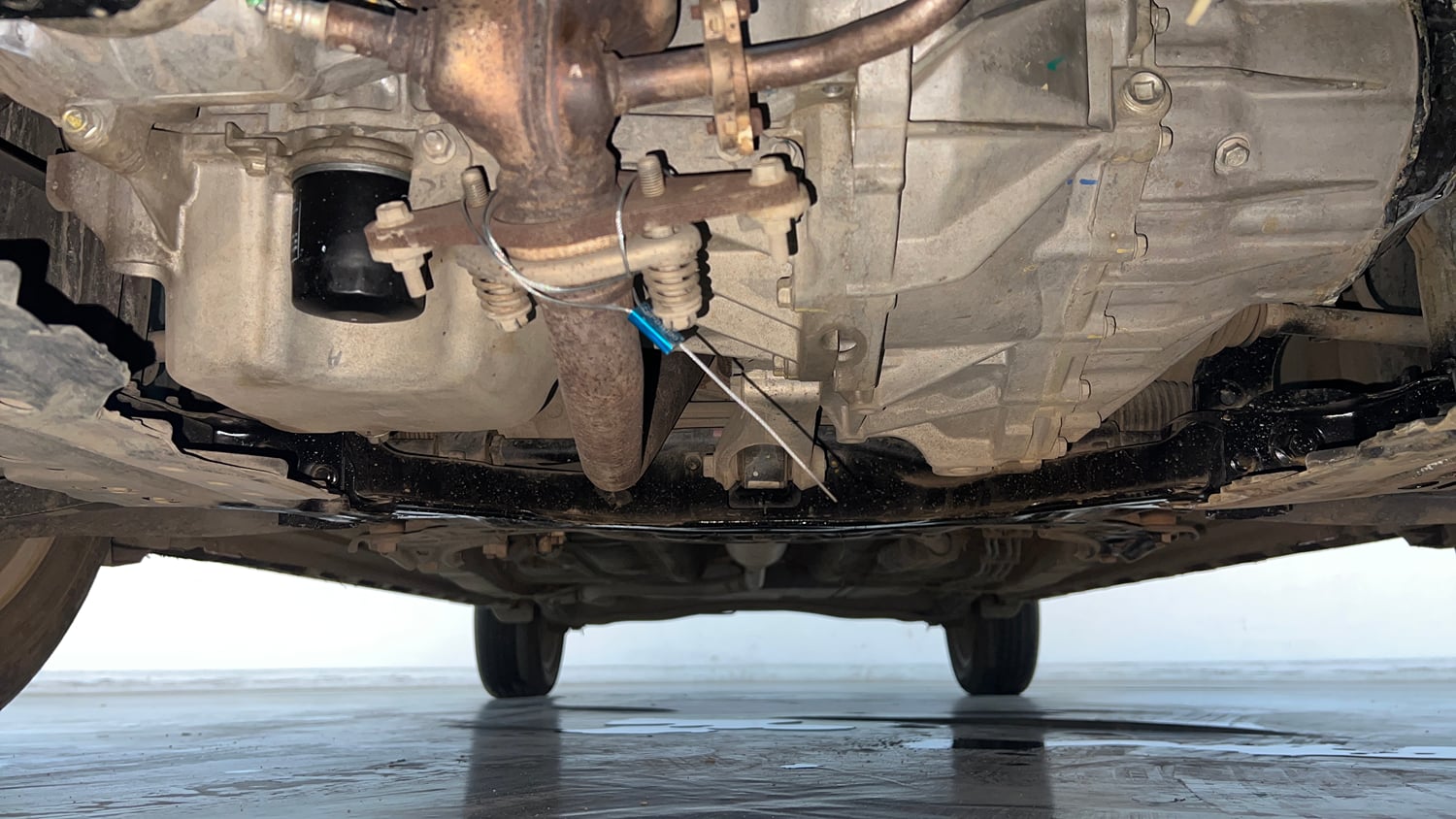 Used 2023 Maruti Suzuki XL6 Alpha Plus MT Petrol Petrol Manual extra FRONT LEFT UNDERBODY VIEW