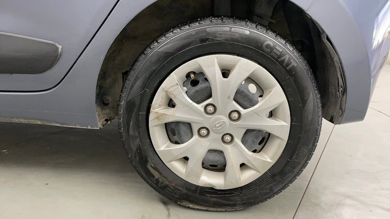 Used 2014 Hyundai Grand i10 Magna 1.2 Kappa VTVT Petrol Manual tyres LEFT REAR TYRE RIM VIEW