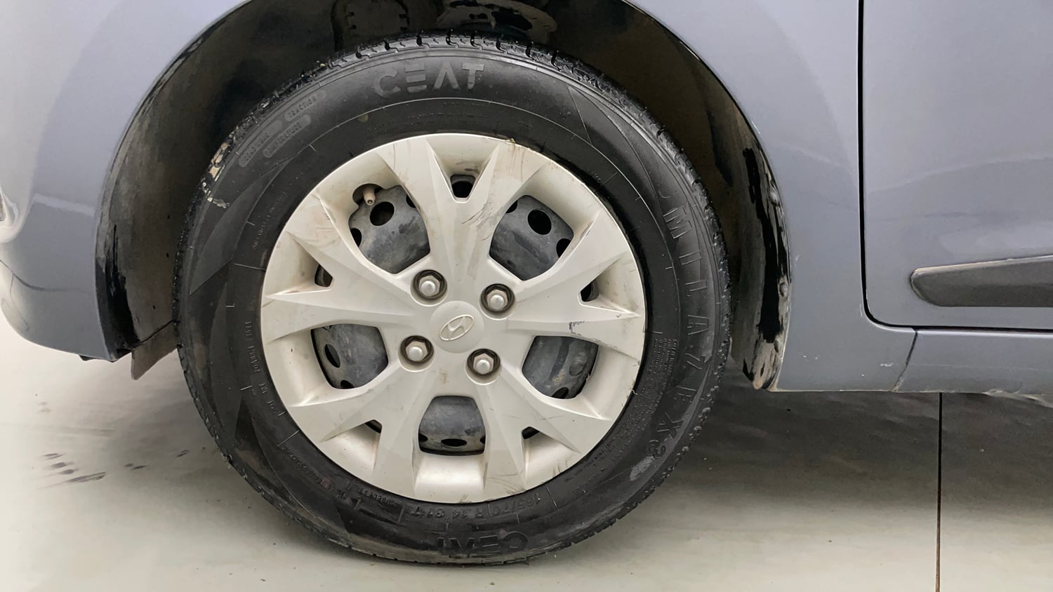 Used 2014 Hyundai Grand i10 Magna 1.2 Kappa VTVT Petrol Manual tyres LEFT FRONT TYRE RIM VIEW