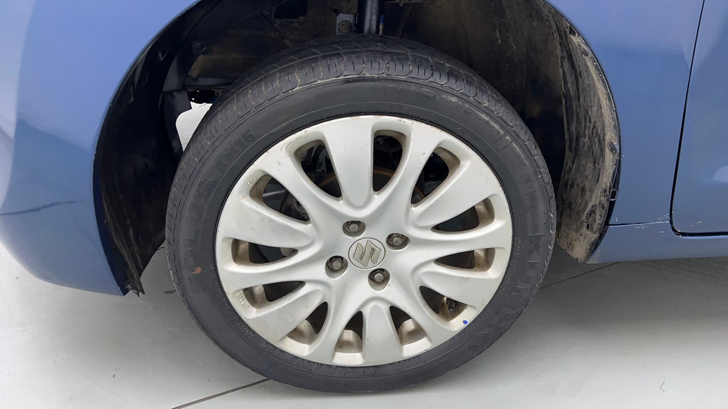 Used 2015 Maruti Suzuki Baleno Zeta 1.2 Petrol Manual tyres LEFT FRONT TYRE RIM VIEW