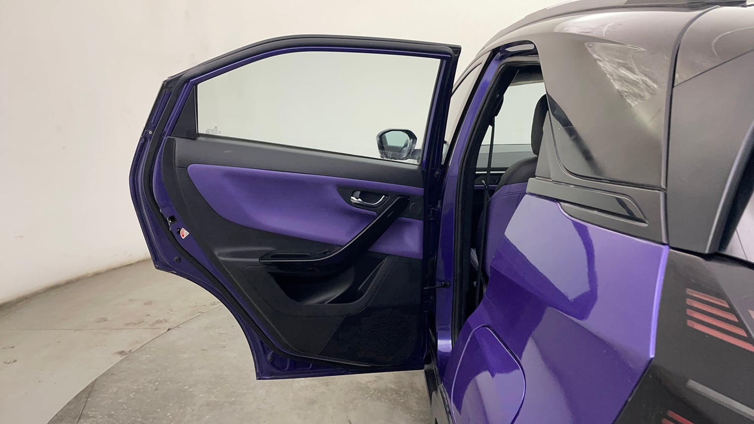 Used 2024 Tata Nexon Fearless Plus S Purple 1.2 Revotron Petrol 7DCA Dual Tone Petrol Automatic interior LEFT REAR DOOR OPEN VIEW