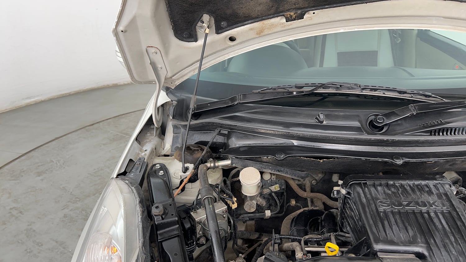 Used 2012 Maruti Suzuki Swift Dzire ZXI Petrol Manual engine ENGINE RIGHT SIDE HINGE & APRON VIEW