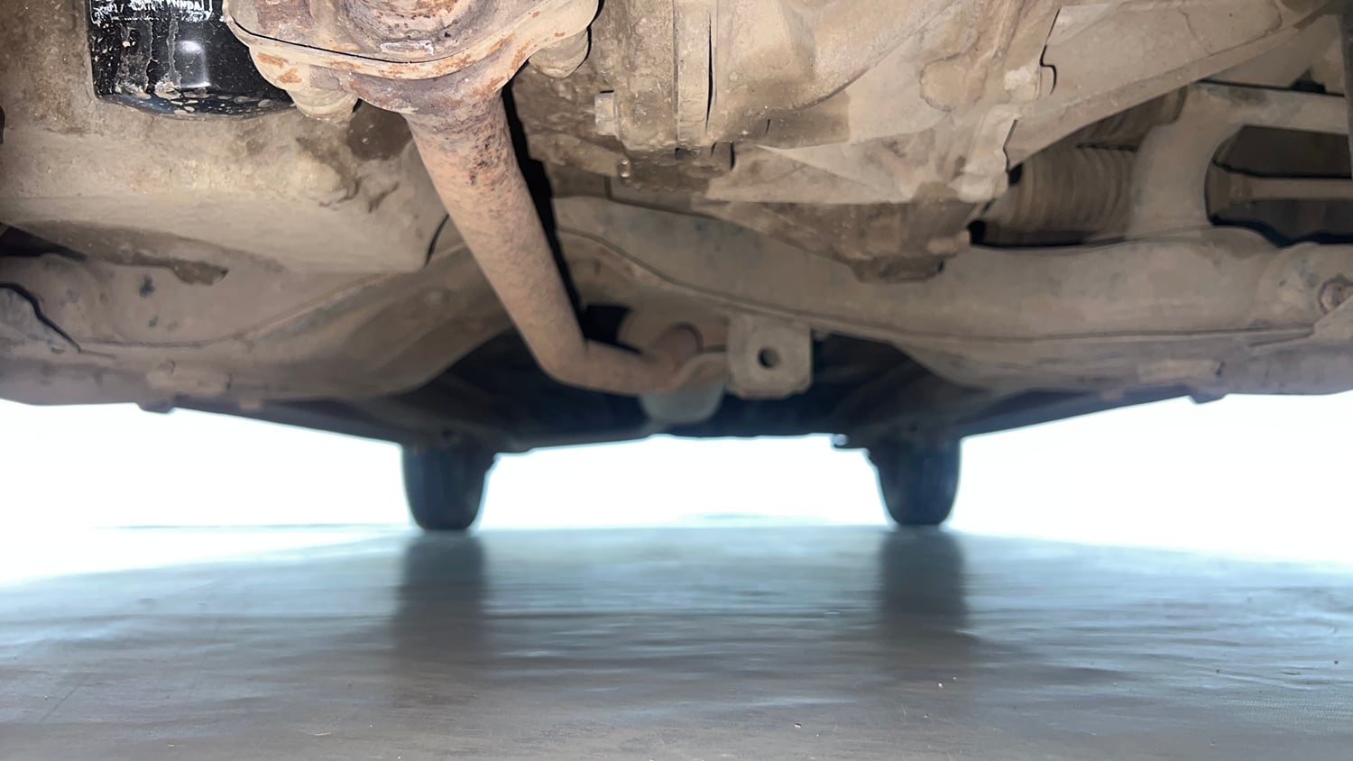 Used 2014 Maruti Suzuki Celerio VXi AMT Petrol Automatic extra FRONT LEFT UNDERBODY VIEW