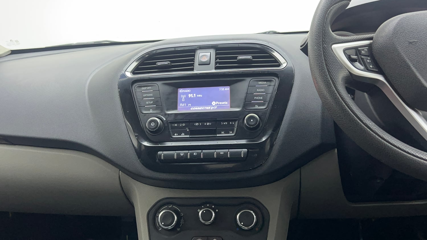 Used 2017 Tata Tiago Revotron XZ Petrol Manual top_features Integrated (in-dash) music system