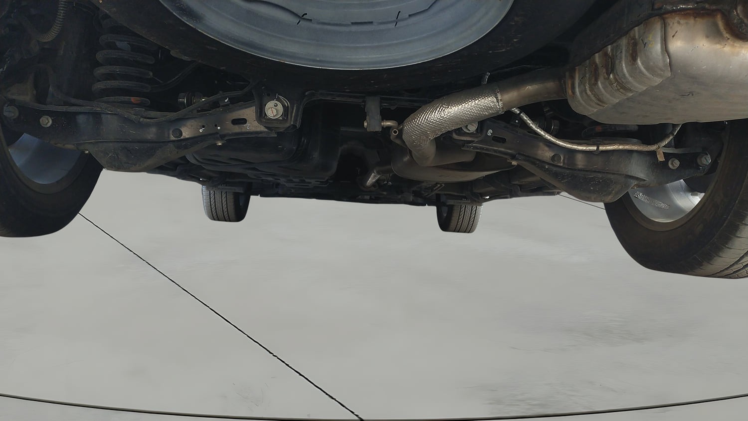 Used 2025 Mahindra XUV700 AX7 Luxury Pack Petrol AT 7 STR Petrol Automatic extra REAR UNDERBODY VIEW (TAKEN FROM REAR)