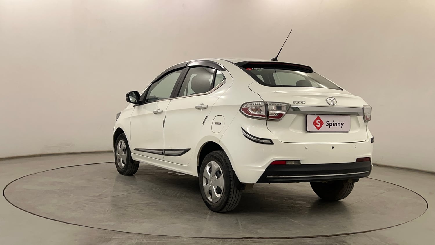 Used 2024 Tata Tigor XZ Petrol Manual exterior LEFT REAR CORNER VIEW