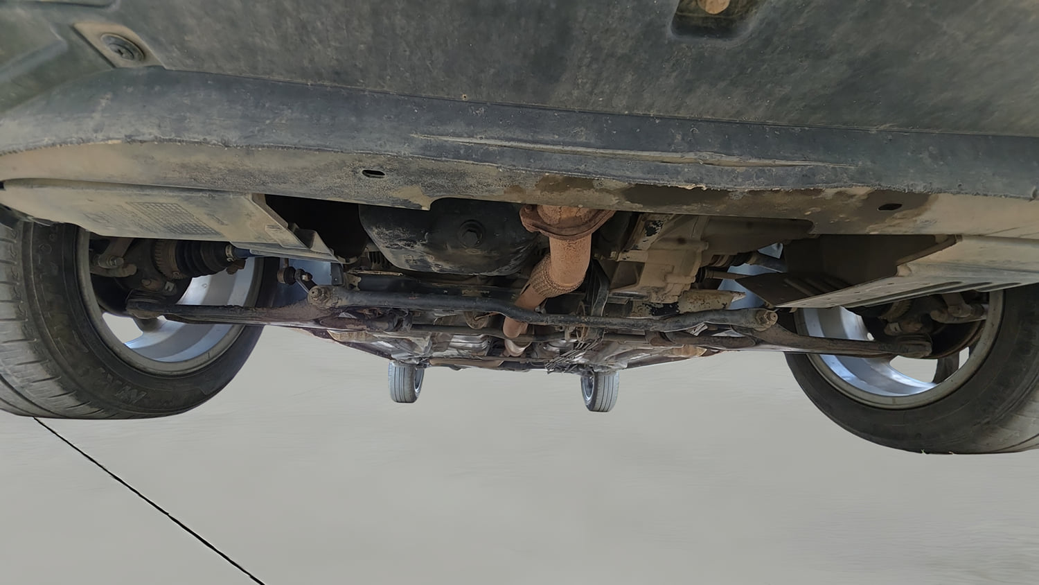 Used 2023 Tata Tigor XZ Plus Leatherette Pack Petrol Manual extra FRONT LEFT UNDERBODY VIEW