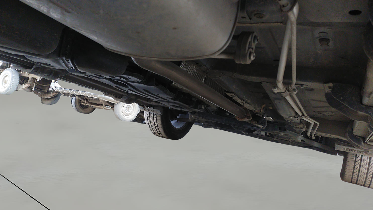 Used 2025 Mahindra XUV700 AX7 Luxury Pack Petrol AT 7 STR Petrol Automatic extra REAR RIGHT UNDERBODY VIEW