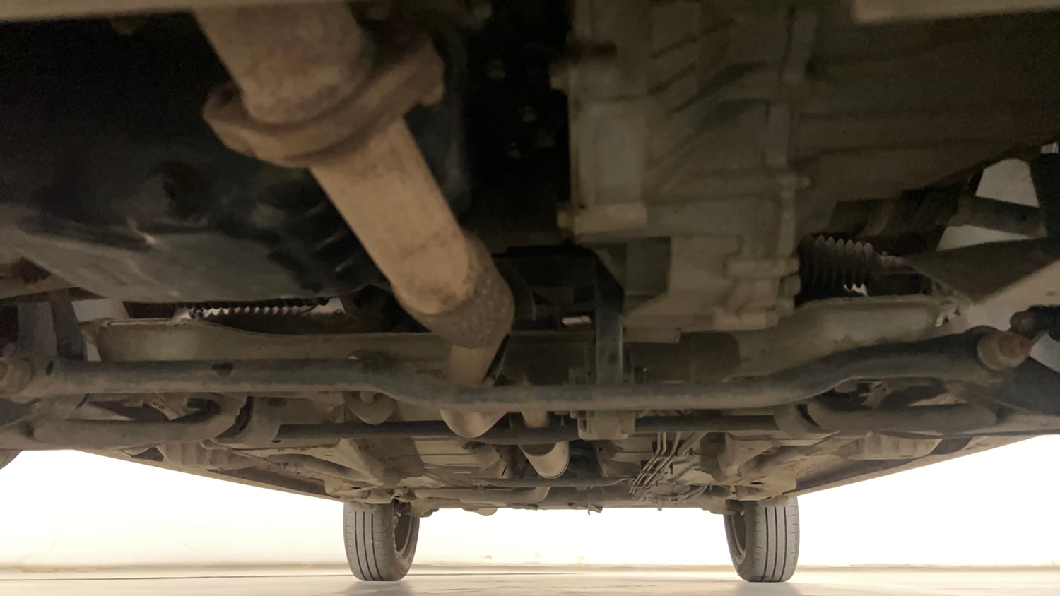 Used 2024 Tata Tigor XZ Petrol Manual extra FRONT LEFT UNDERBODY VIEW