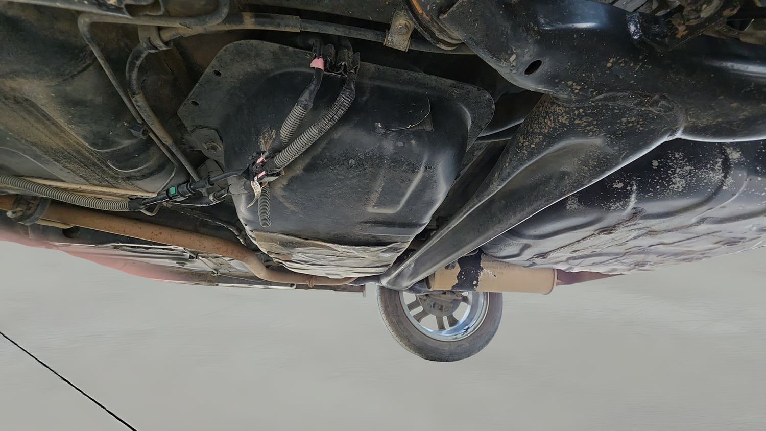 Used 2023 Tata Tigor XZ Plus Leatherette Pack Petrol Manual extra REAR UNDERBODY VIEW (TAKEN FROM REAR)