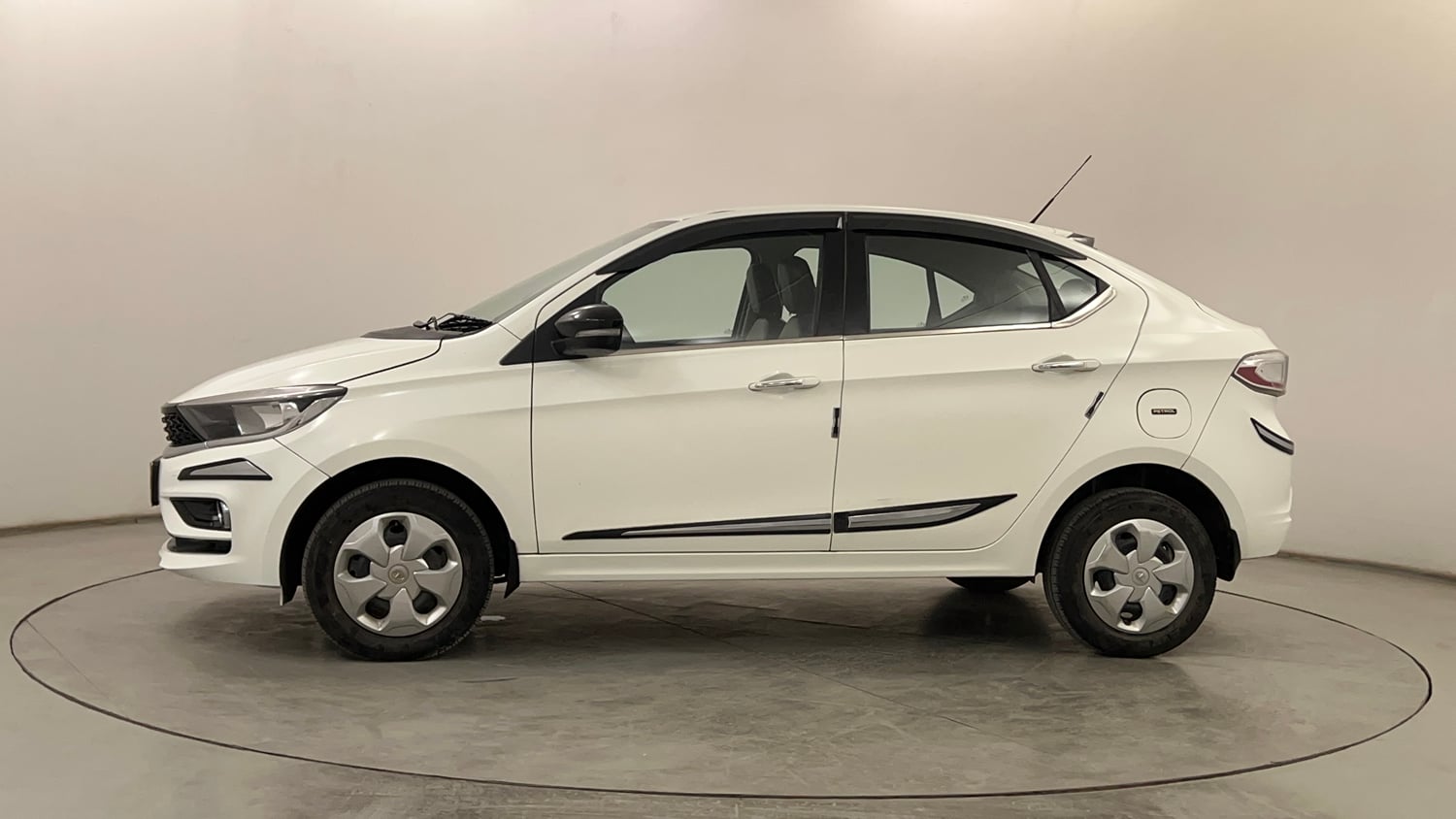 Used 2024 Tata Tigor XZ Petrol Manual exterior LEFT SIDE VIEW