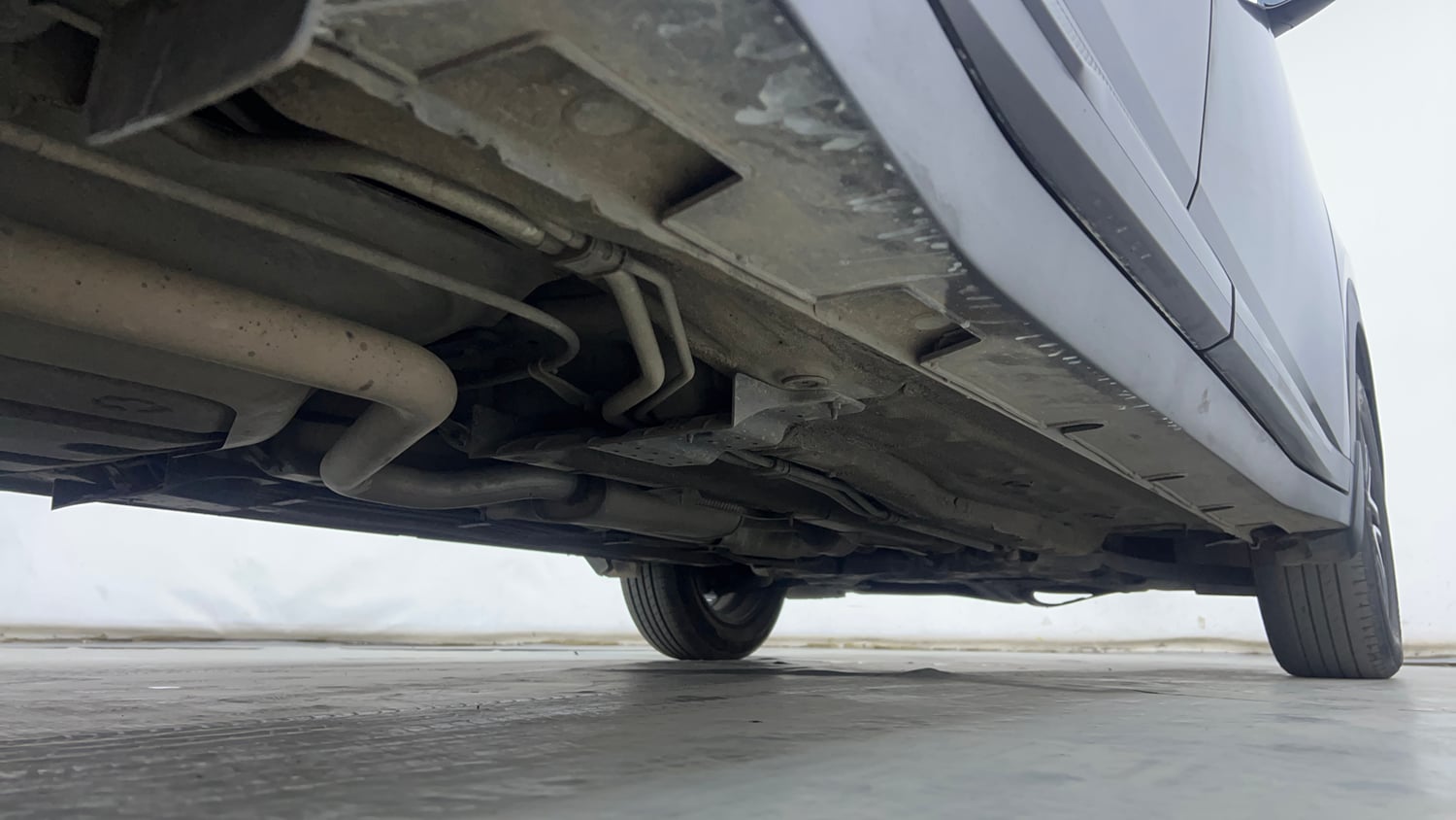 Used 2023 Kia Carens Prestige Plus 1.4 Petrol MT 7 STR Petrol Manual extra REAR RIGHT UNDERBODY VIEW