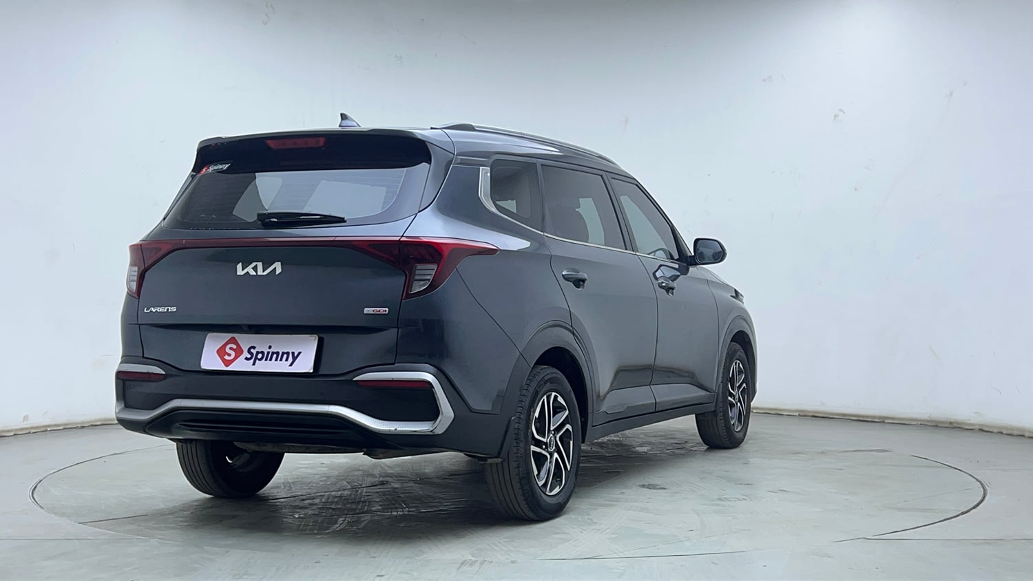Used 2023 Kia Carens Prestige Plus 1.4 Petrol MT 7 STR Petrol Manual exterior RIGHT REAR CORNER VIEW