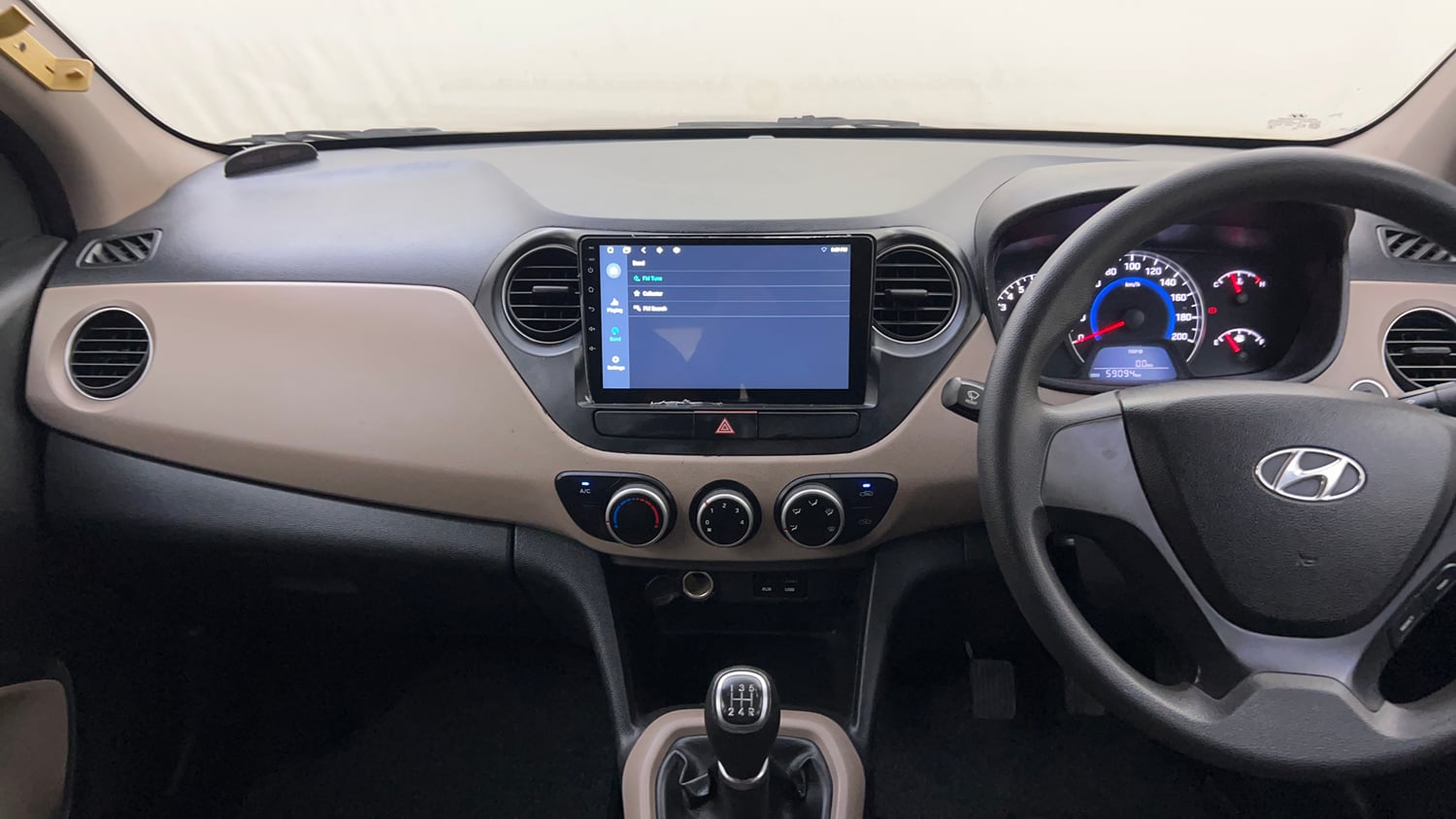 Used 2013 Hyundai Grand i10 Sportz 1.2 Kappa VTVT Petrol Manual interior MUSIC SYSTEM & AC CONTROL VIEW