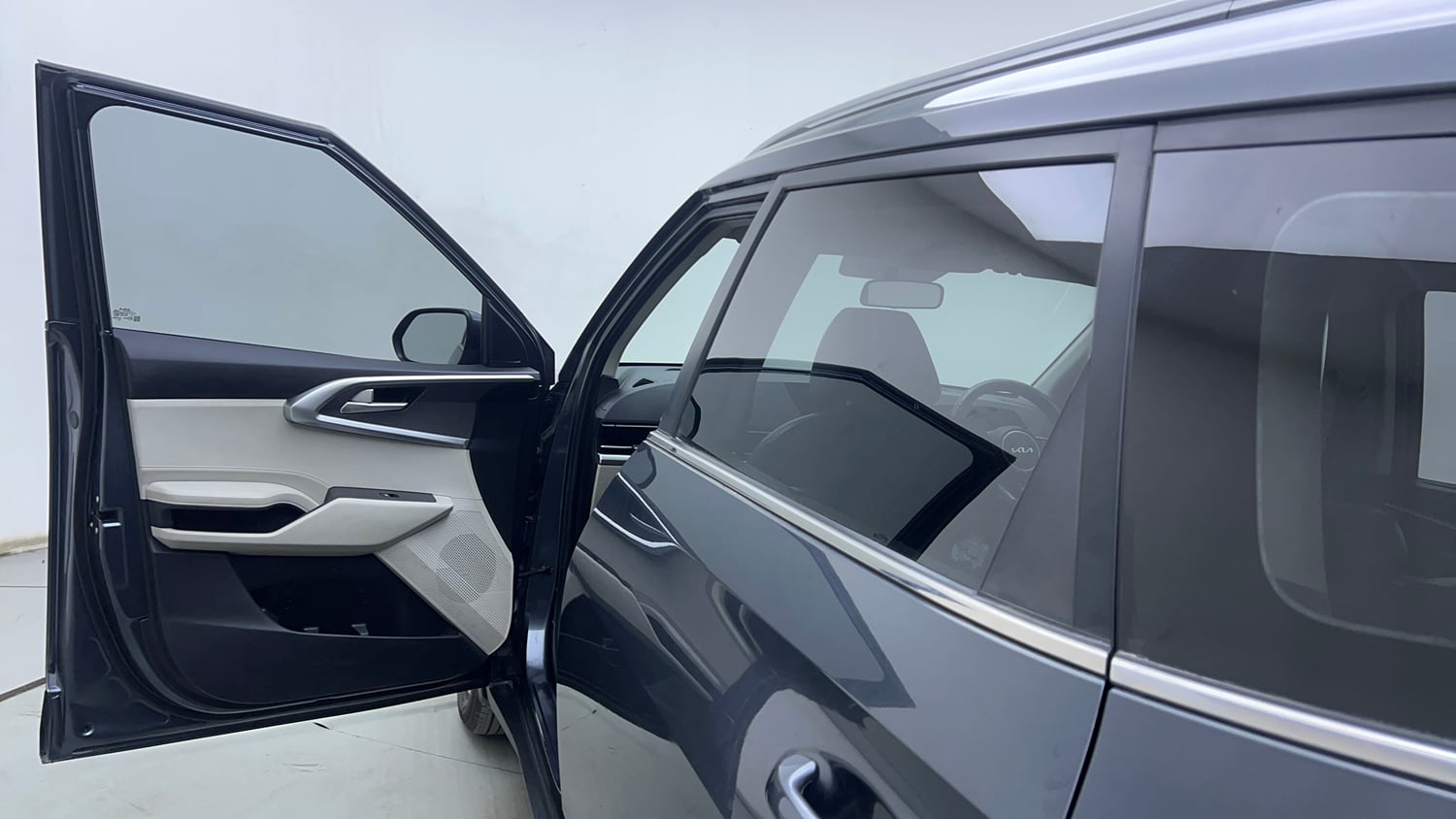 Used 2023 Kia Carens Prestige Plus 1.4 Petrol MT 7 STR Petrol Manual interior LEFT FRONT DOOR OPEN VIEW