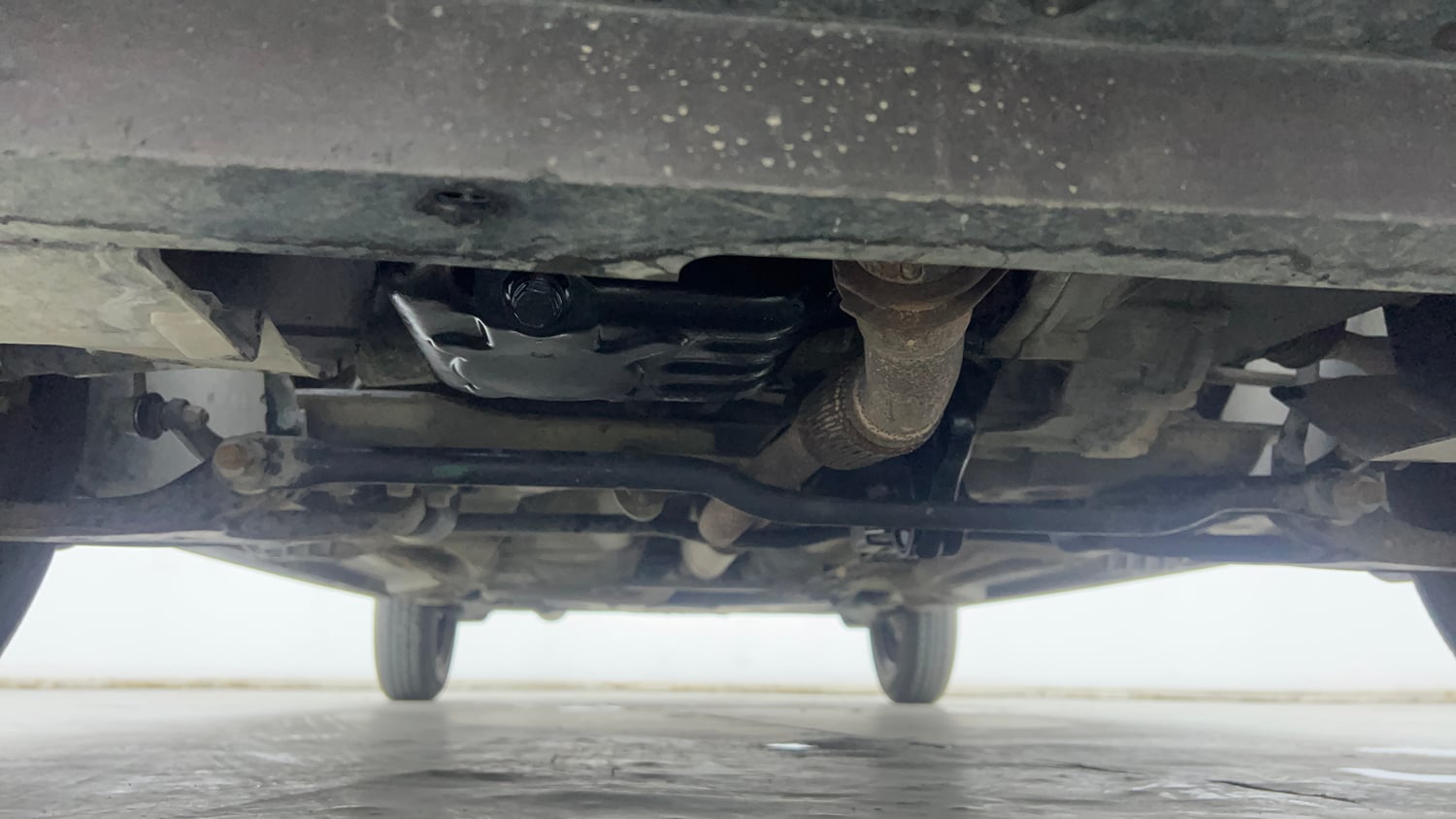Used 2016 Tata Tiago Revotron XM Petrol Manual extra FRONT LEFT UNDERBODY VIEW