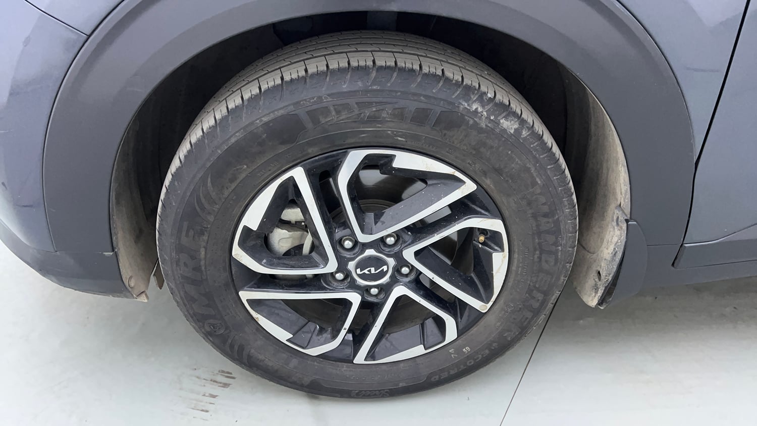 Used 2023 Kia Carens Prestige Plus 1.4 Petrol MT 7 STR Petrol Manual tyres LEFT FRONT TYRE RIM VIEW