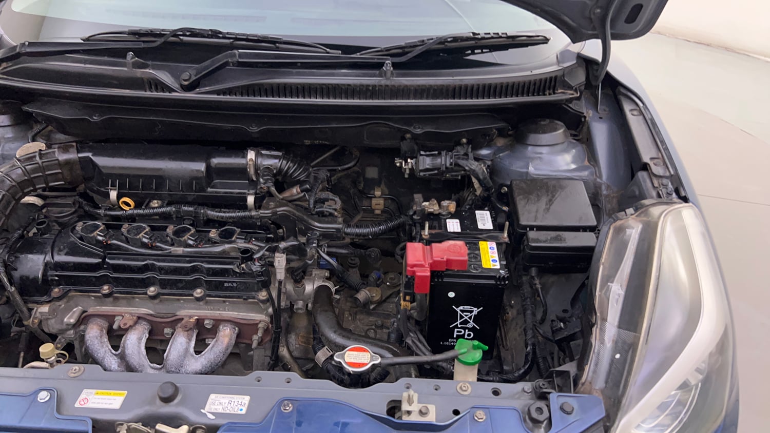 Used 2016 Maruti Suzuki Baleno Alpha 1.2 Petrol Manual engine ENGINE LEFT SIDE HINGE & APRON VIEW