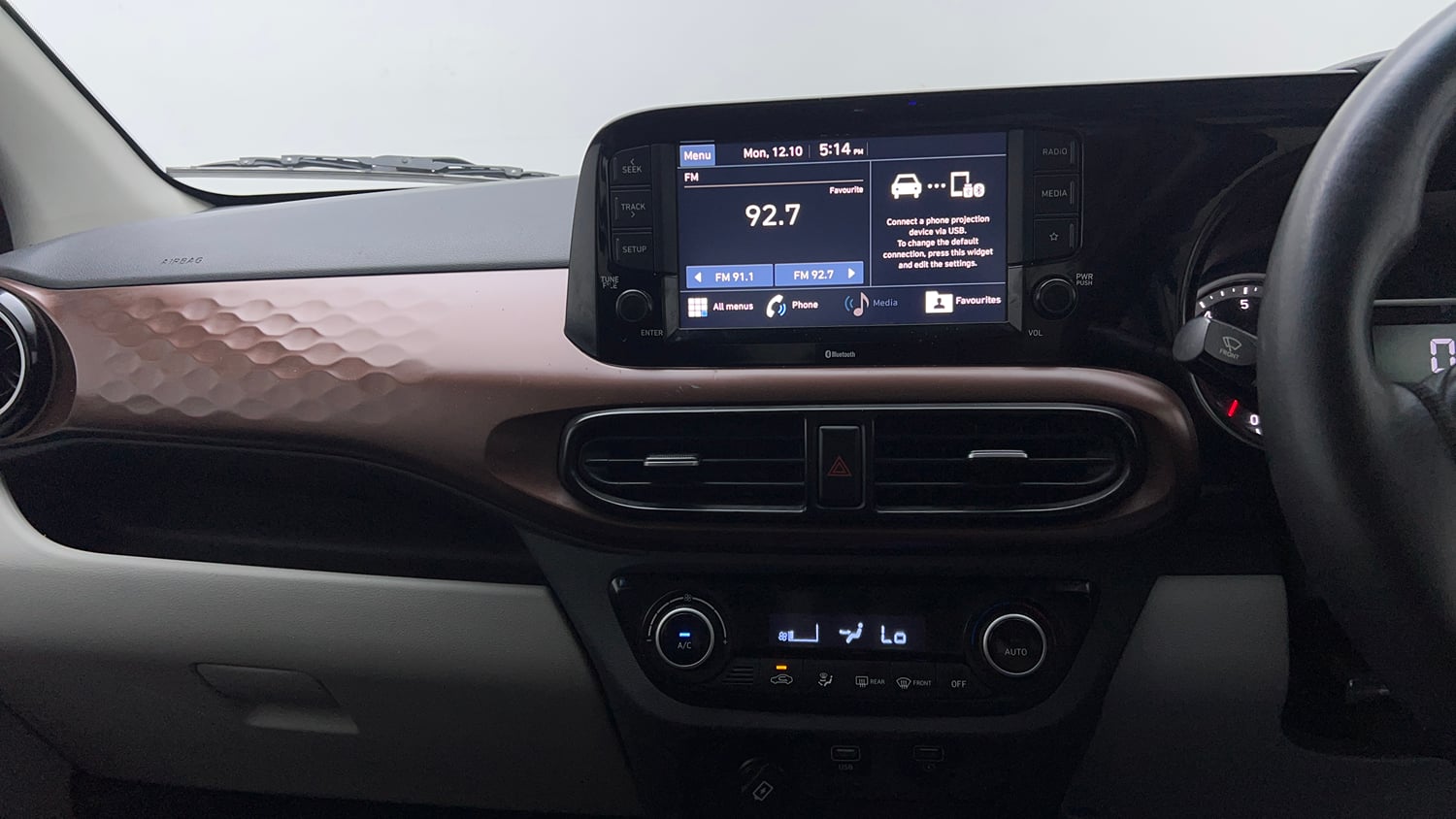 Used 2021 Hyundai Aura SX Plus 1.2 AMT Petrol Petrol Automatic interior MUSIC SYSTEM & AC CONTROL VIEW
