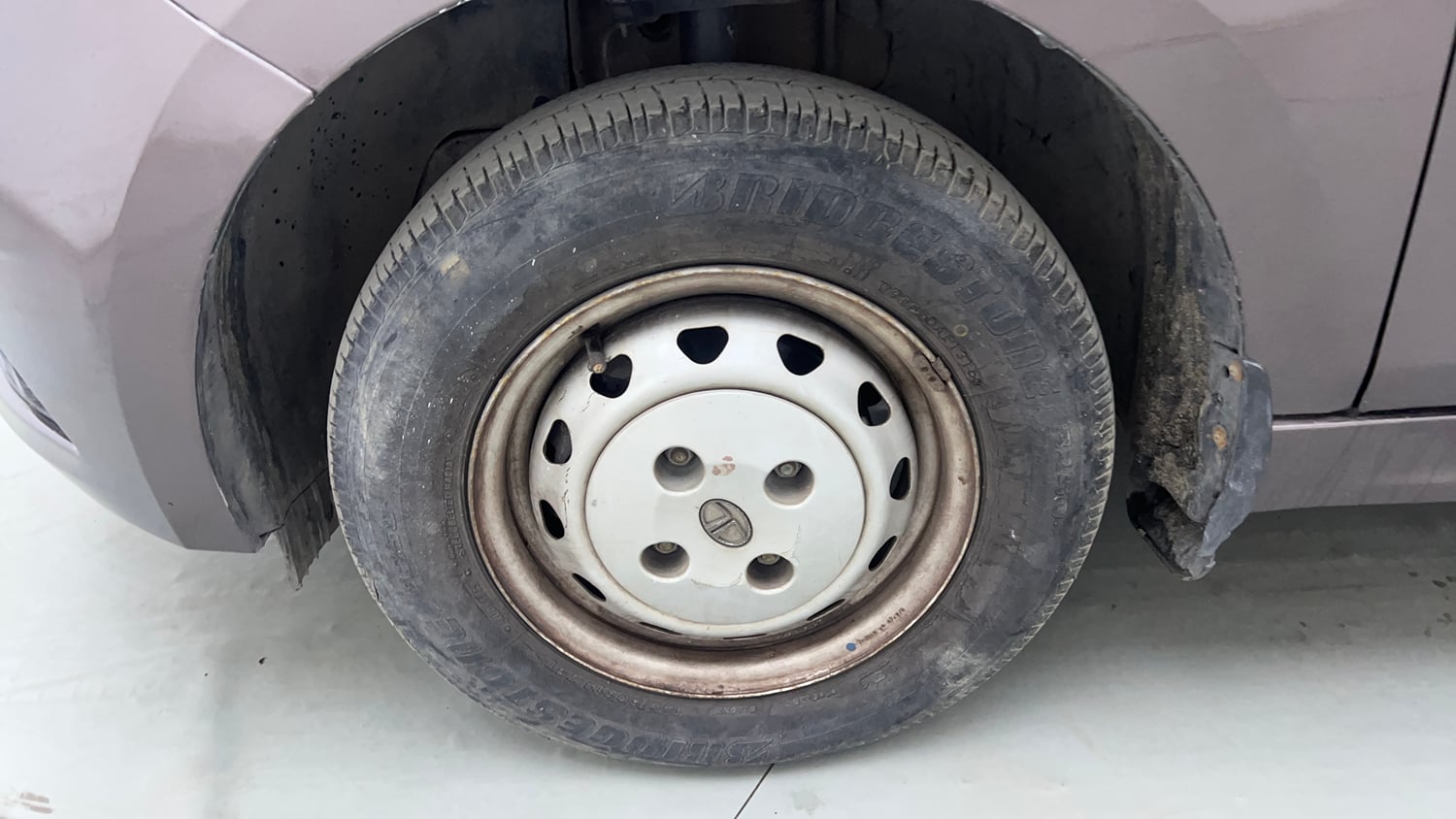 Used 2016 Tata Tiago Revotron XM Petrol Manual tyres LEFT FRONT TYRE RIM VIEW