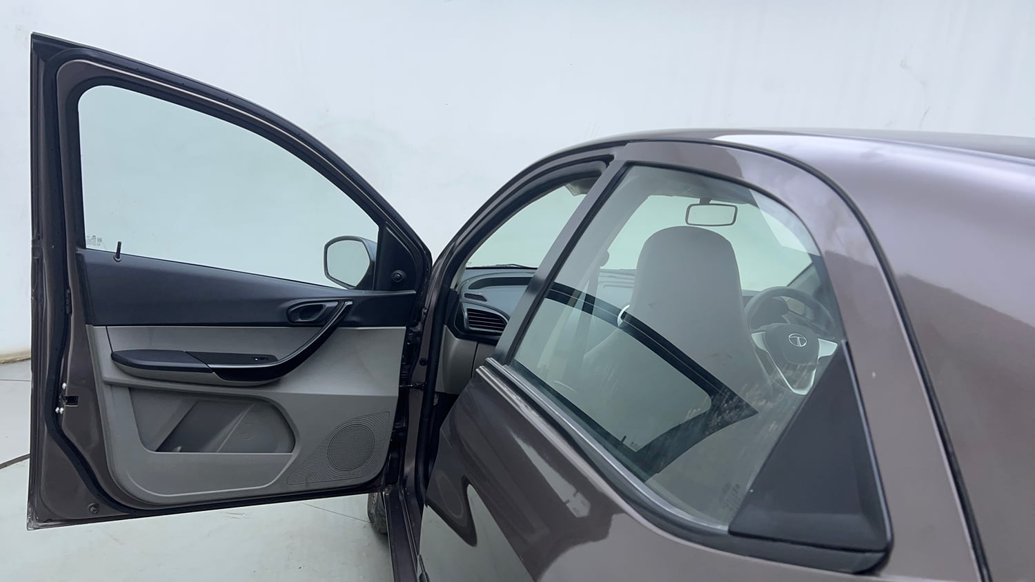 Used 2016 Tata Tiago Revotron XM Petrol Manual interior LEFT FRONT DOOR OPEN VIEW