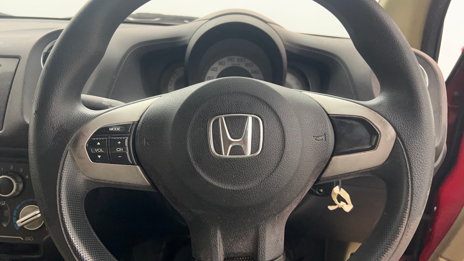 Used 2014 Honda Brio S MT Petrol Manual top_features Steering mounted controls