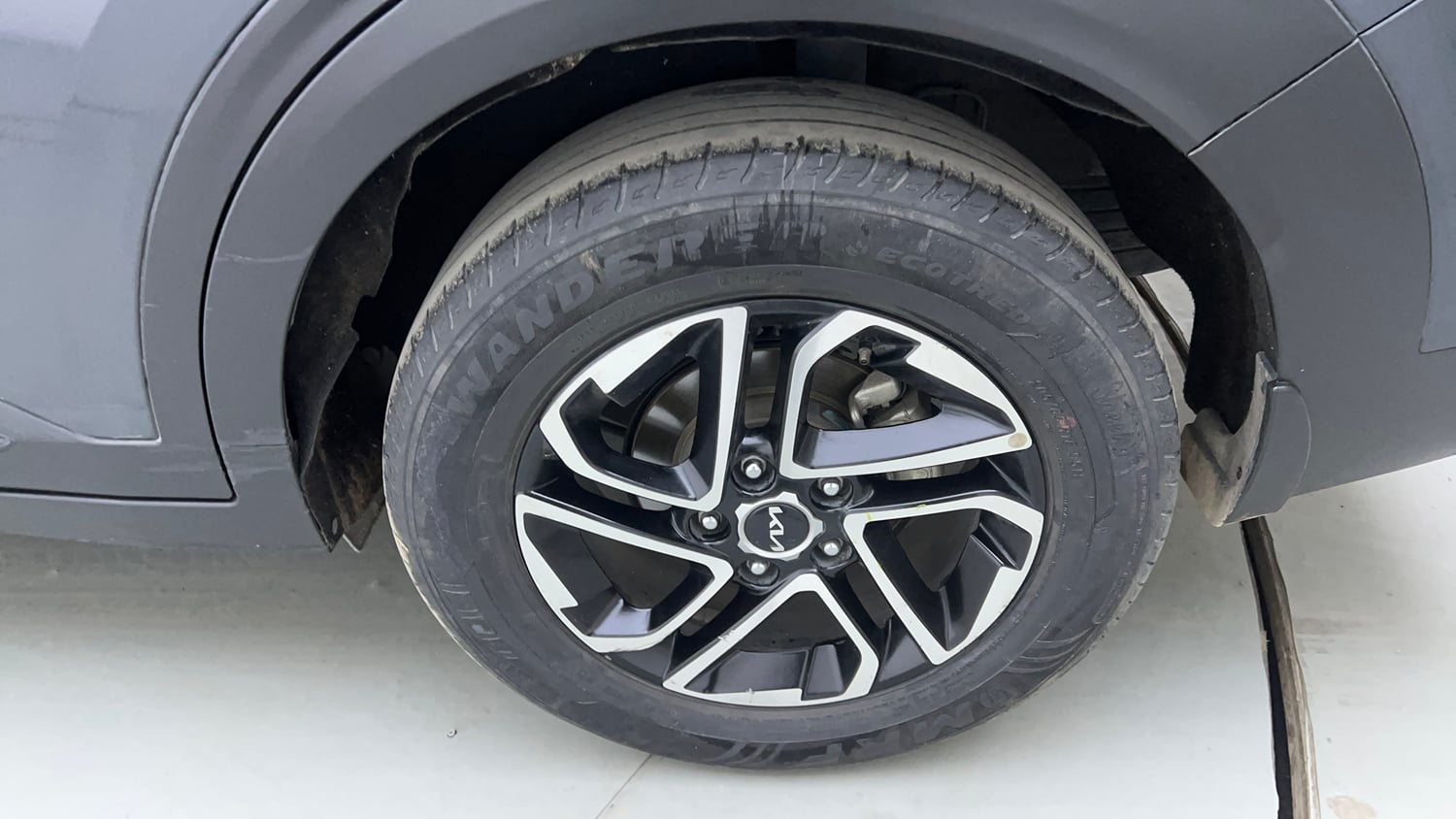 Used 2023 Kia Carens Prestige Plus 1.4 Petrol MT 7 STR Petrol Manual tyres LEFT REAR TYRE RIM VIEW