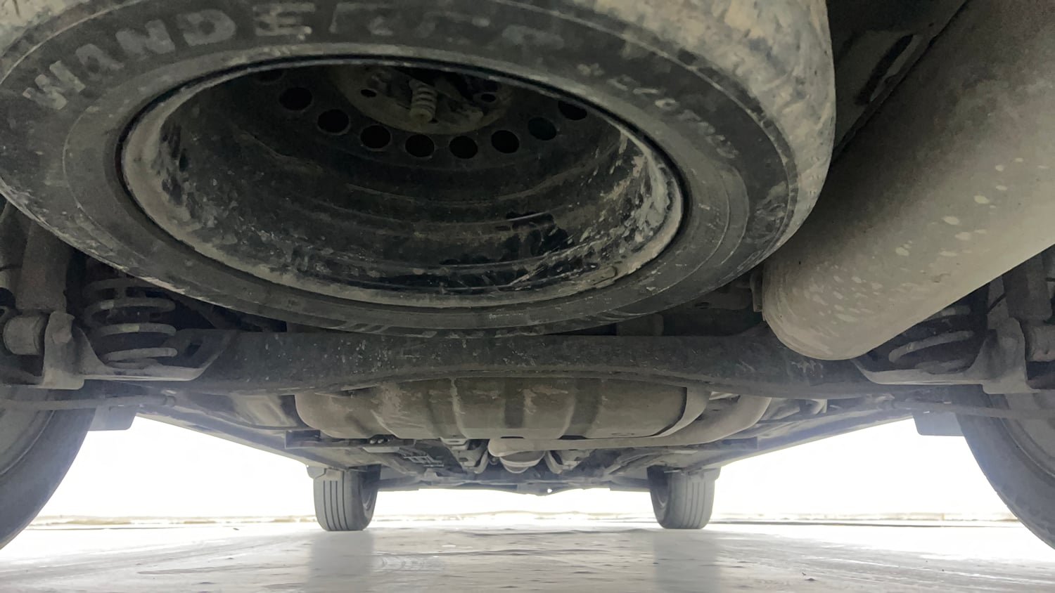 Used 2023 Kia Carens Prestige Plus 1.4 Petrol MT 7 STR Petrol Manual extra REAR UNDERBODY VIEW (TAKEN FROM REAR)