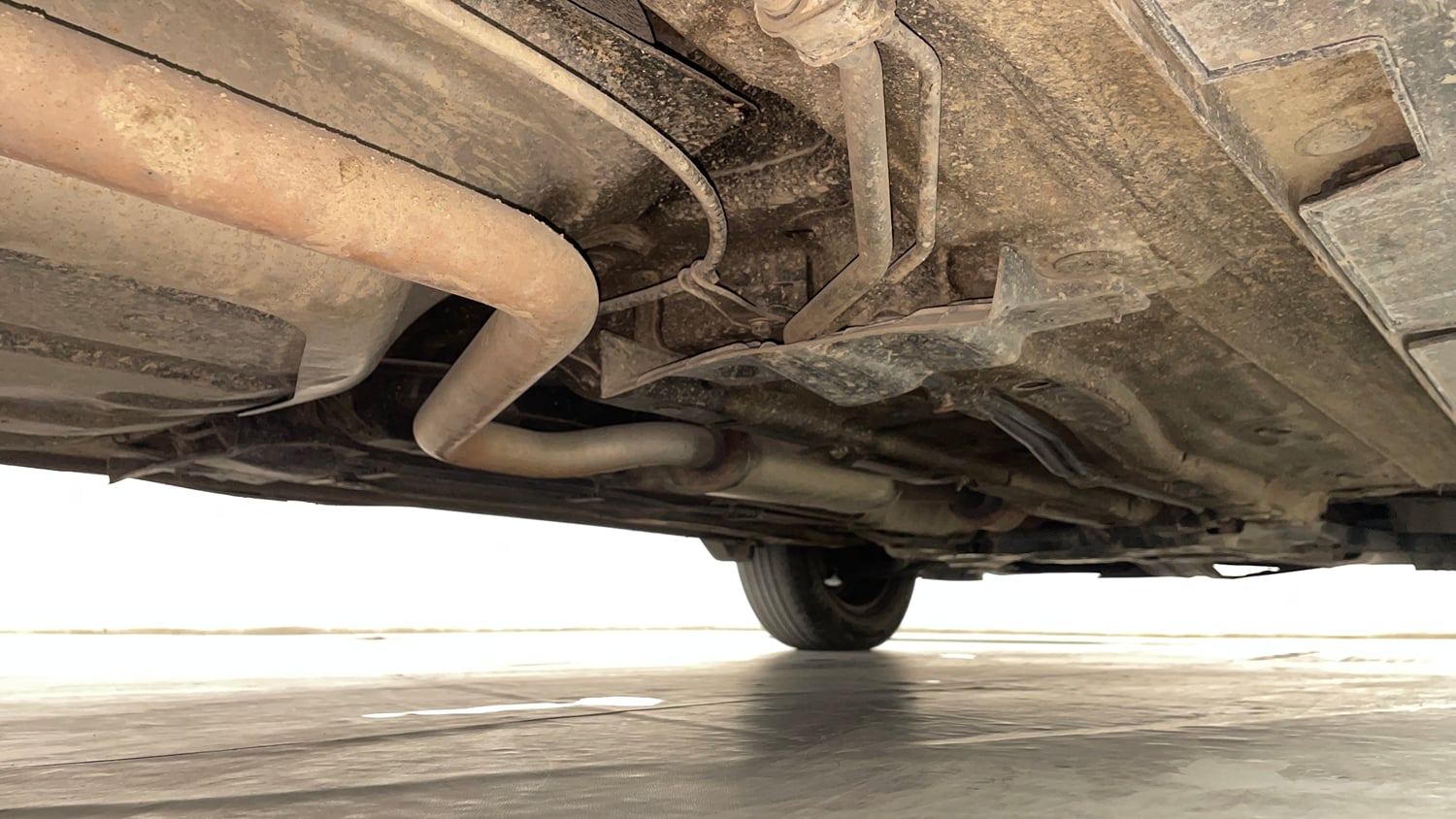 Used 2022 Kia Carens Prestige 1.4 Petrol MT 7 STR Petrol Manual extra REAR RIGHT UNDERBODY VIEW