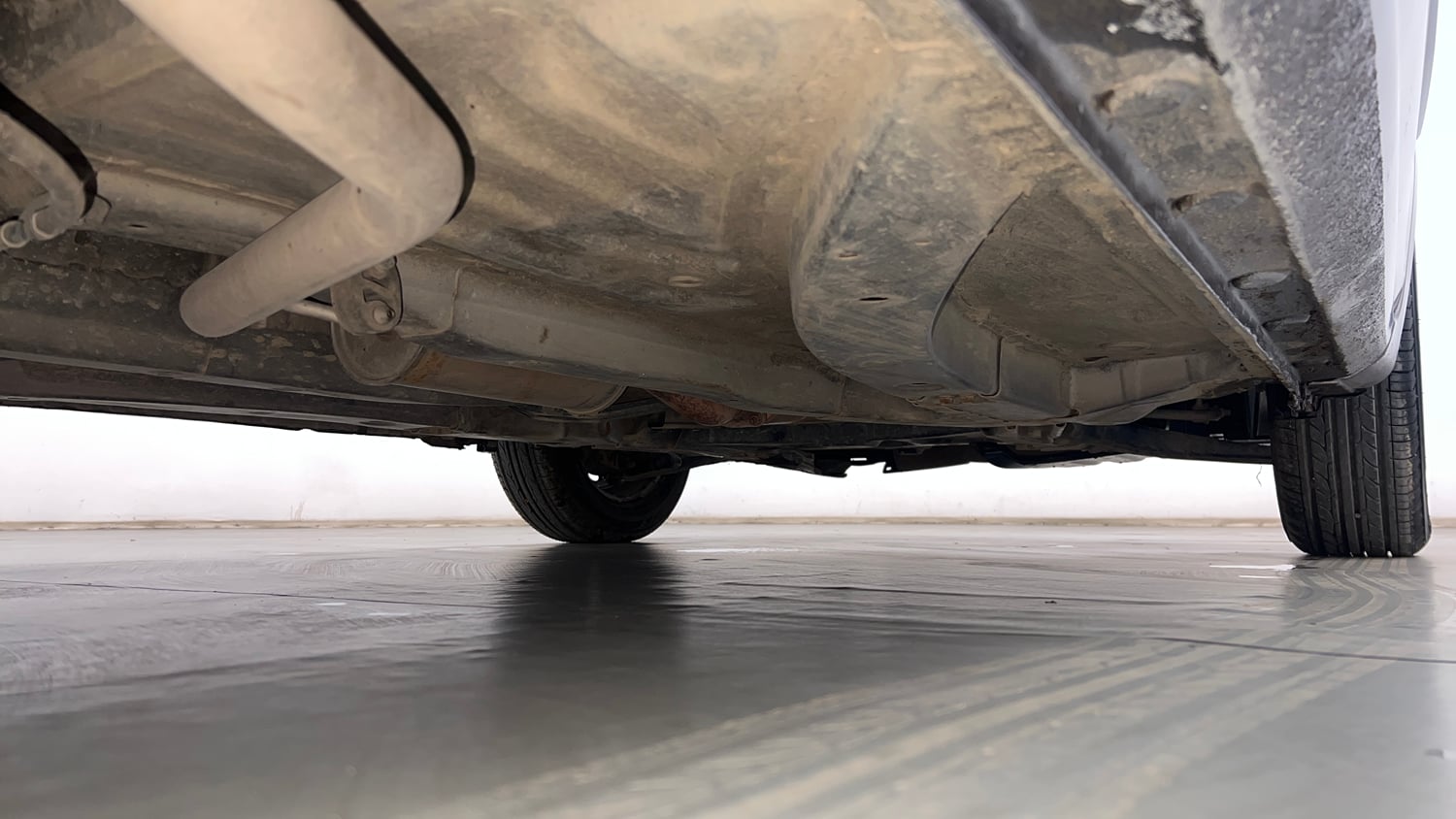 Used 2013 Honda Brio E MT Petrol Manual extra REAR RIGHT UNDERBODY VIEW