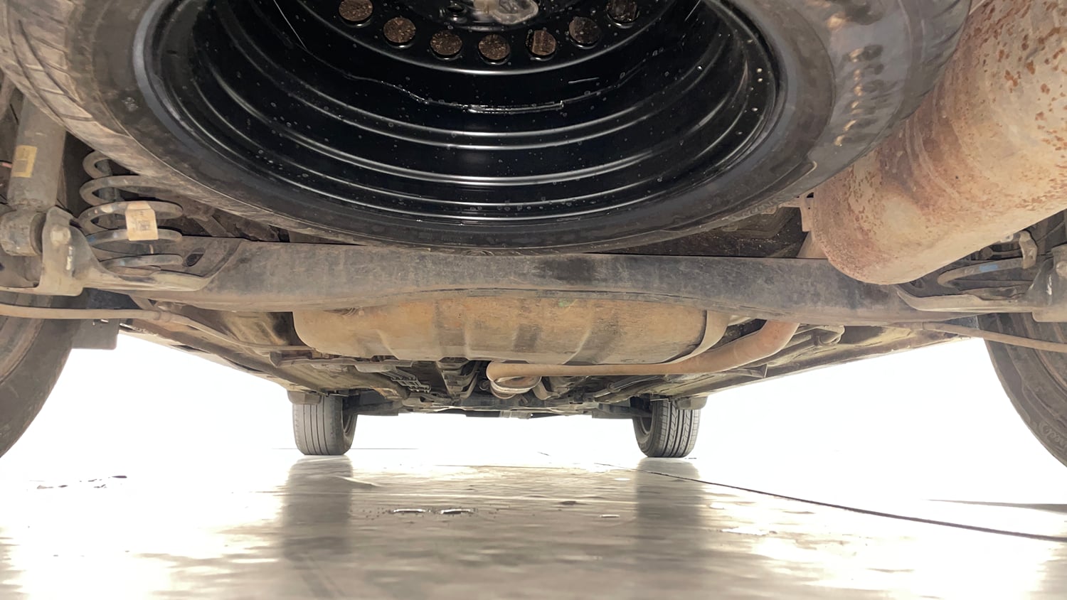 Used 2022 Kia Carens Prestige 1.4 Petrol MT 7 STR Petrol Manual extra REAR UNDERBODY VIEW (TAKEN FROM REAR)