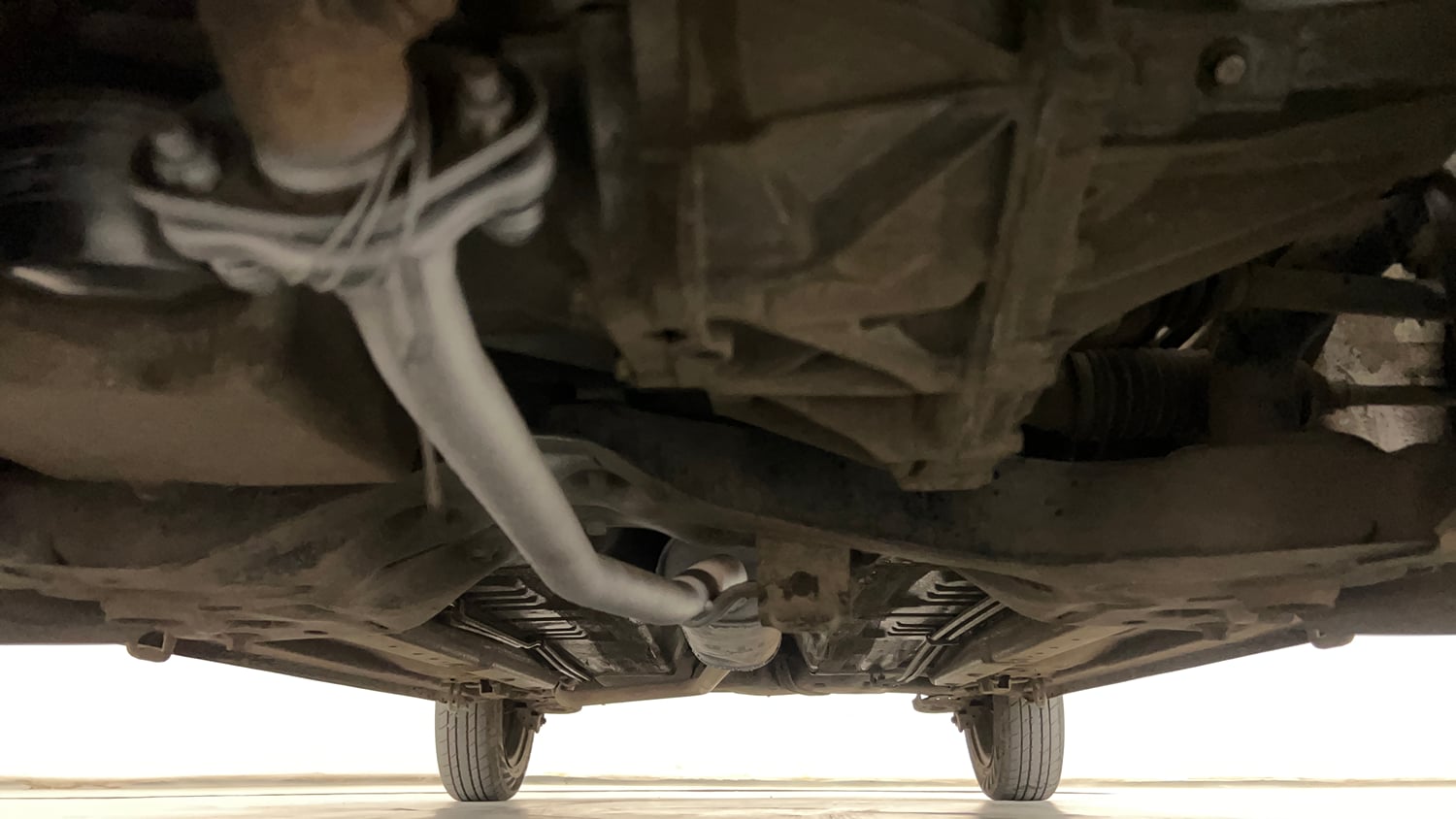Used 2015 Maruti Suzuki Celerio VXi AMT Petrol Automatic extra FRONT LEFT UNDERBODY VIEW