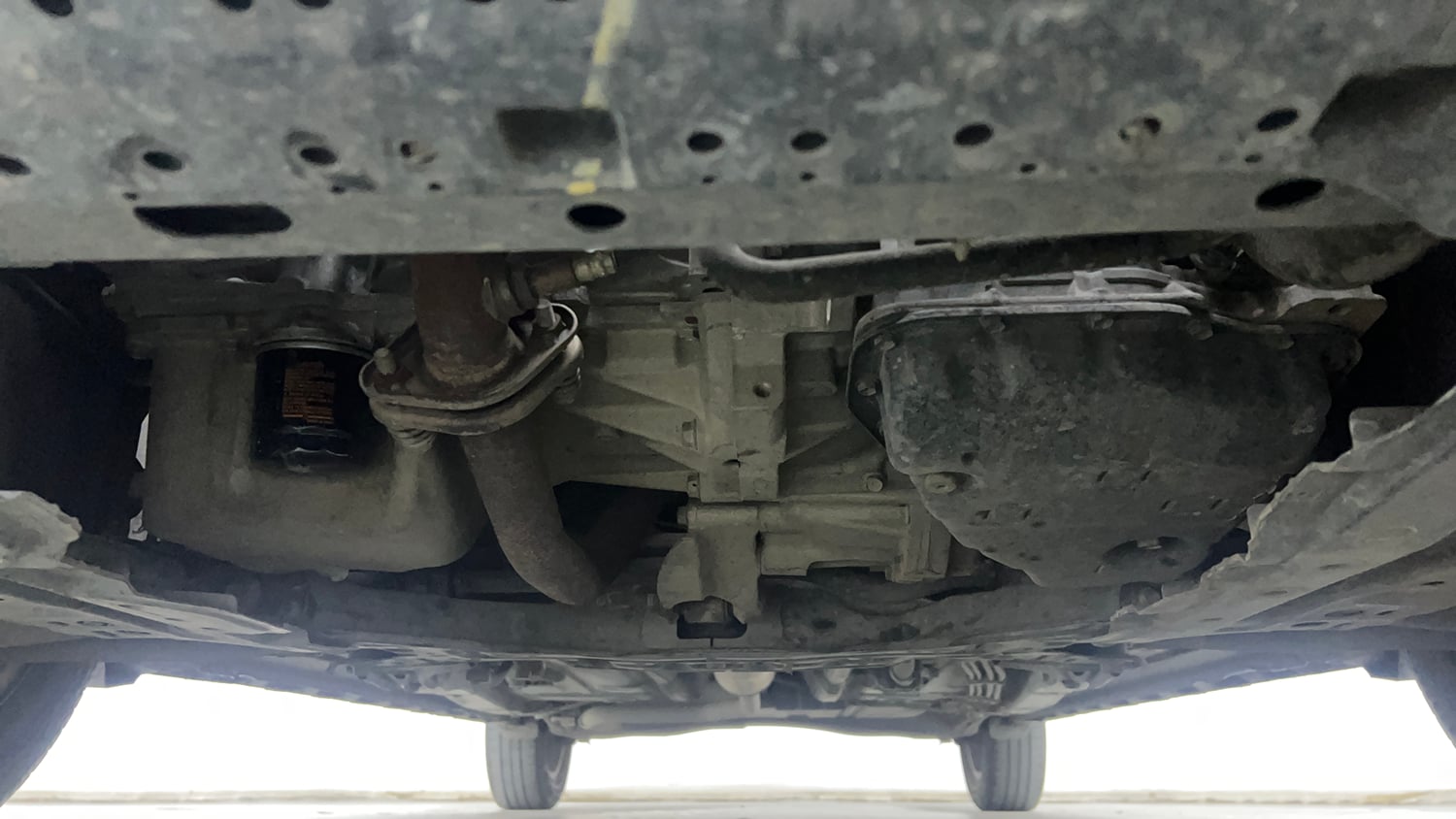 Used 2021 Maruti Suzuki XL6 Alpha AT Petrol Petrol Automatic extra FRONT LEFT UNDERBODY VIEW