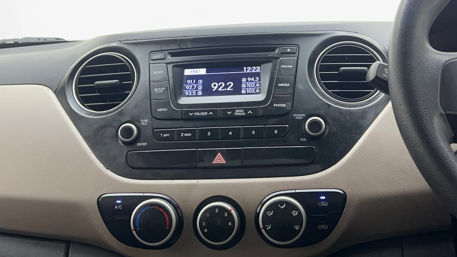 Used 2013 Hyundai Grand i10 Sportz 1.2 Kappa VTVT Petrol Manual interior MUSIC SYSTEM & AC CONTROL VIEW
