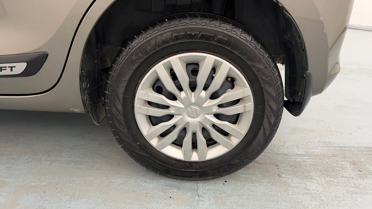 Used 2022 Maruti Suzuki Swift VXi Petrol Manual tyres LEFT REAR TYRE RIM VIEW
