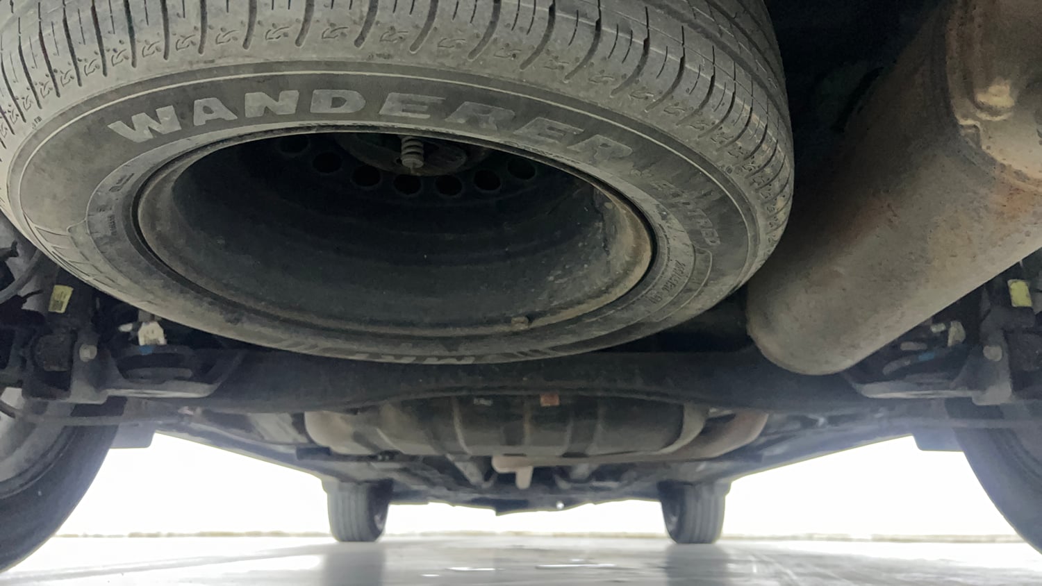 Used 2023 Kia Carens Prestige Plus 1.5 Diesel MT 7 STR Diesel Manual extra REAR UNDERBODY VIEW (TAKEN FROM REAR)