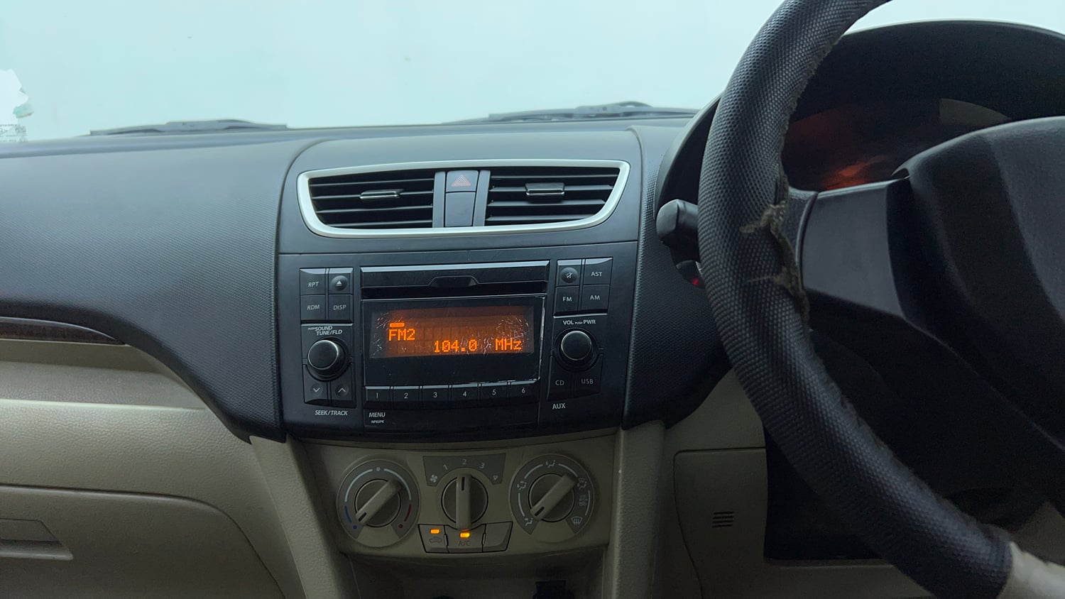 Used 2015 Maruti Suzuki Swift Dzire VXI Petrol Manual top_features Integrated (in-dash) music system