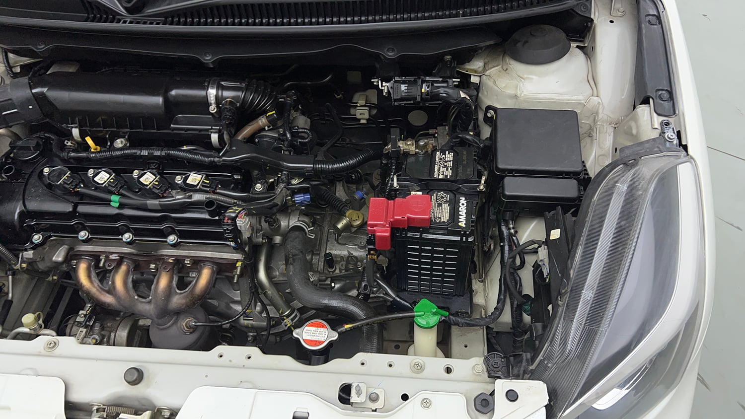 Used 2021 Maruti Suzuki Baleno Delta Petrol Manual engine ENGINE LEFT SIDE VIEW