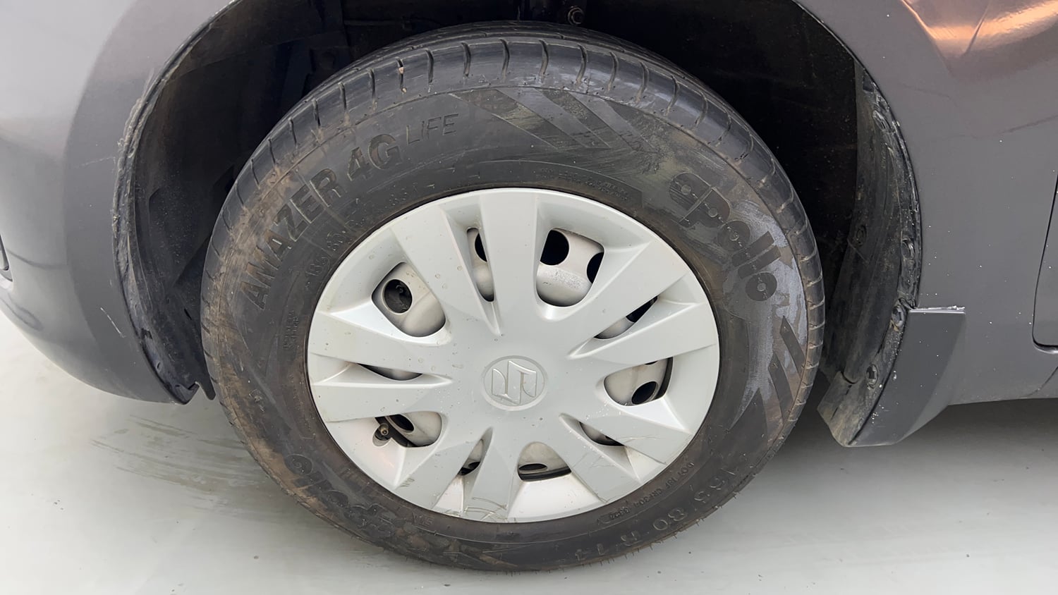 Used 2017 Maruti Suzuki Swift Lxi (O) Petrol Manual tyres LEFT FRONT TYRE RIM VIEW