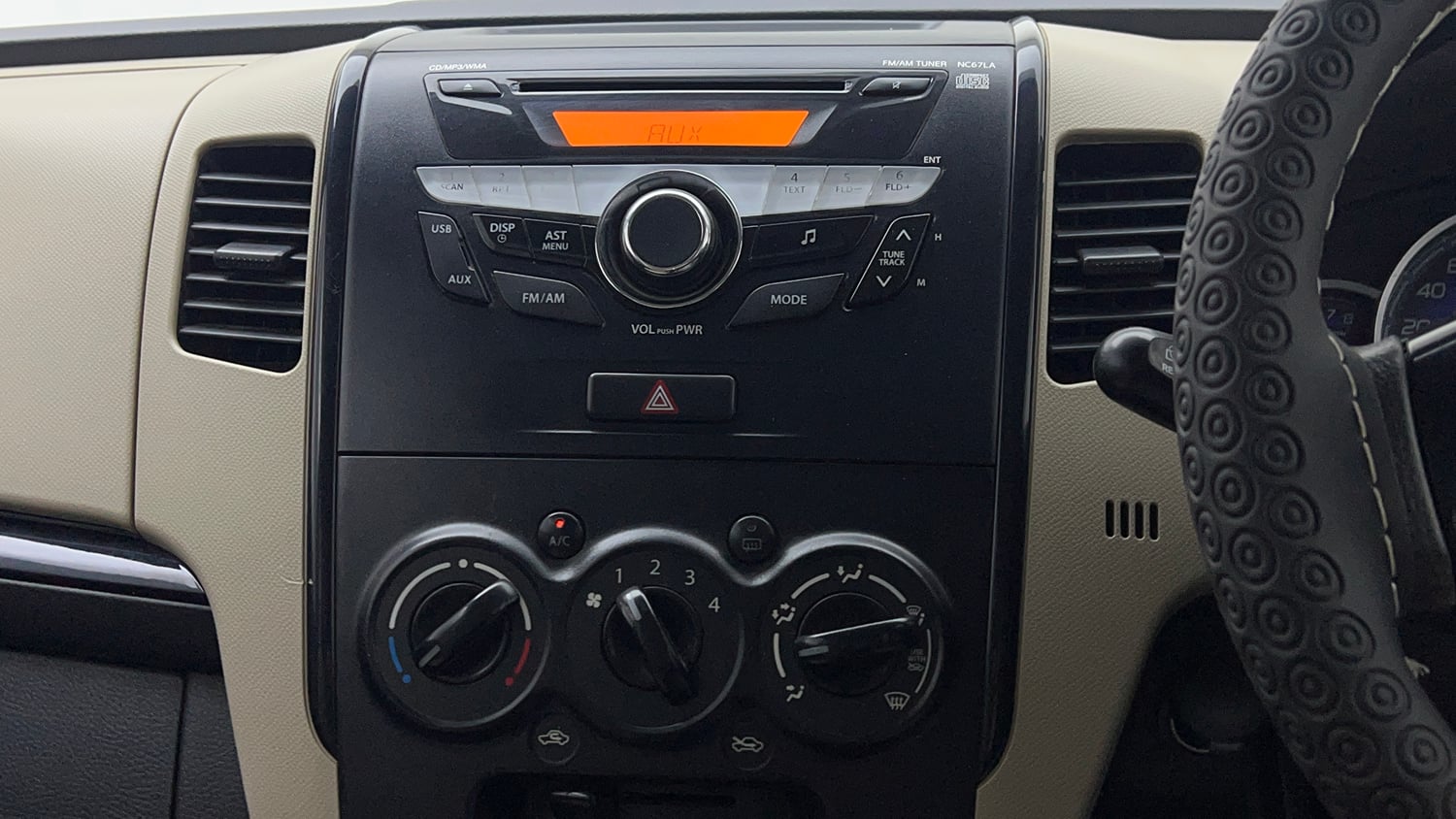 Used 2018 Maruti Suzuki Wagon R VXI Petrol Manual top_features Integrated (in-dash) music system