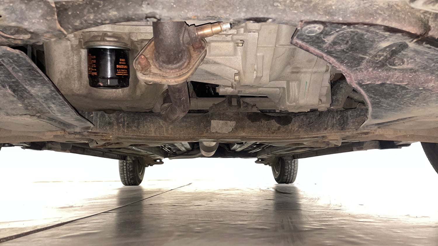 Used 2017 Maruti Suzuki Swift Lxi ABS (O) Petrol Manual extra FRONT LEFT UNDERBODY VIEW