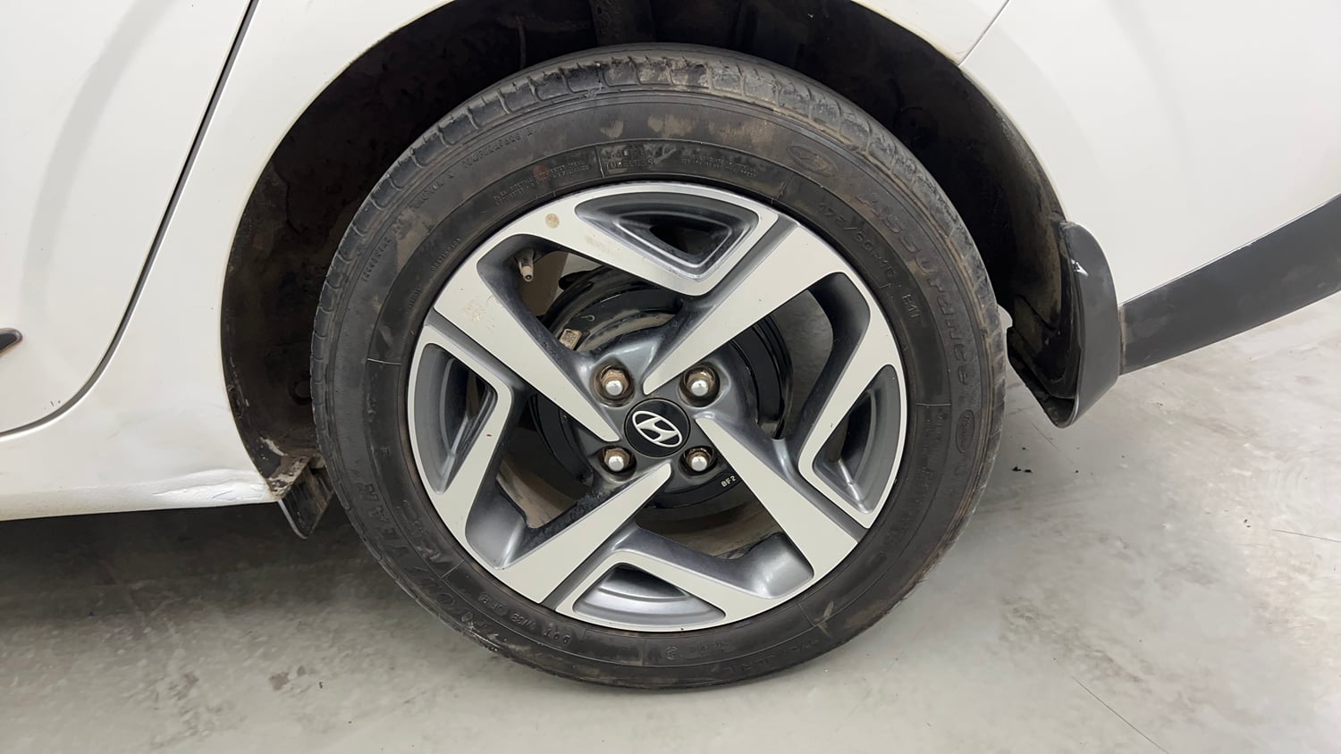 Used 2021 Hyundai Aura SX 1.2 Petrol Petrol Manual tyres LEFT REAR TYRE RIM VIEW