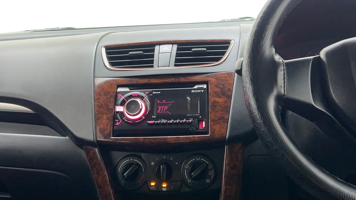 Used 2017 Maruti Suzuki Swift Lxi (O) Petrol Manual interior MUSIC SYSTEM & AC CONTROL VIEW
